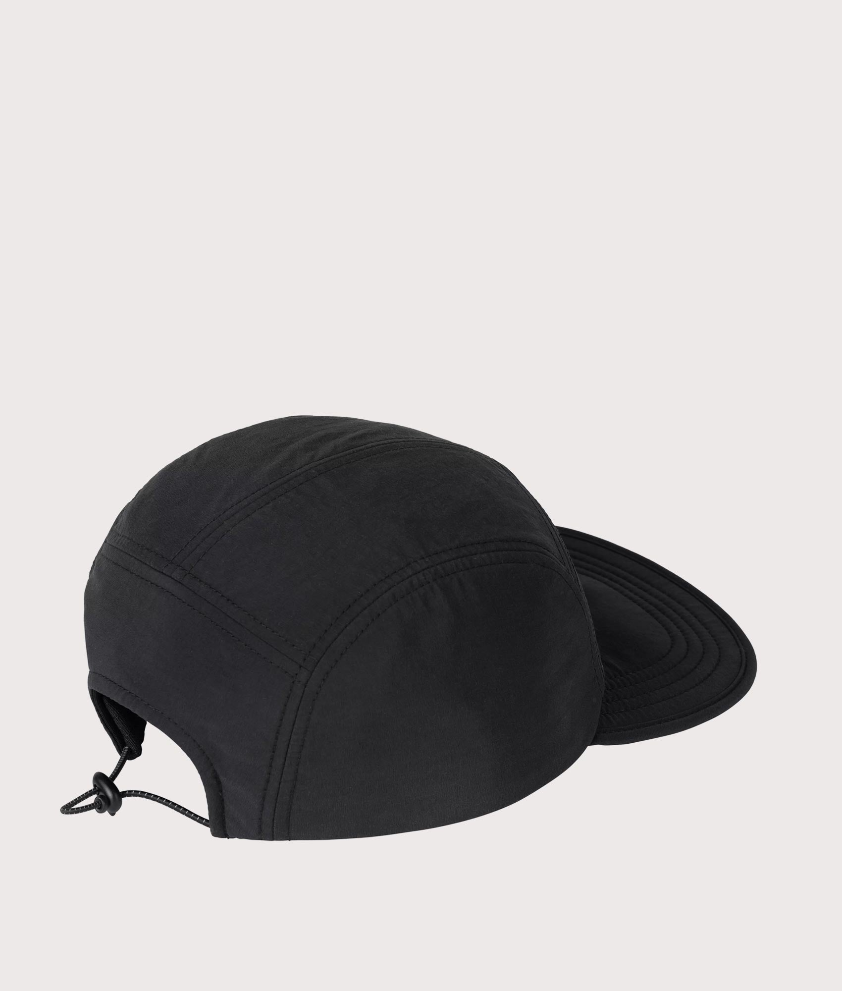 Carhartt WIP Travon Cap in Black and Wax at EQVVS Menswear. Angled back shot.