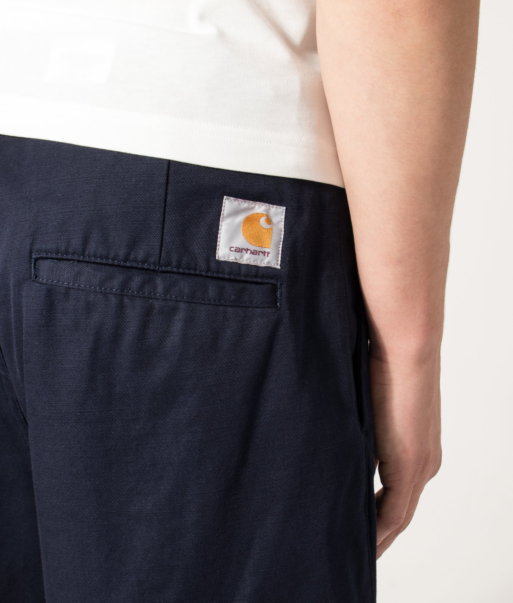 Carhartt WIP Loose Fit Brader Shorts in  Dark Navy at EQVVS Menswear. Detail shot.