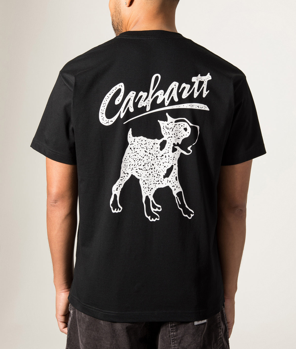 Carhartt WIP Loose Fit Pup T-Shirt in Black at EQVVS Menswear. Model back shot.