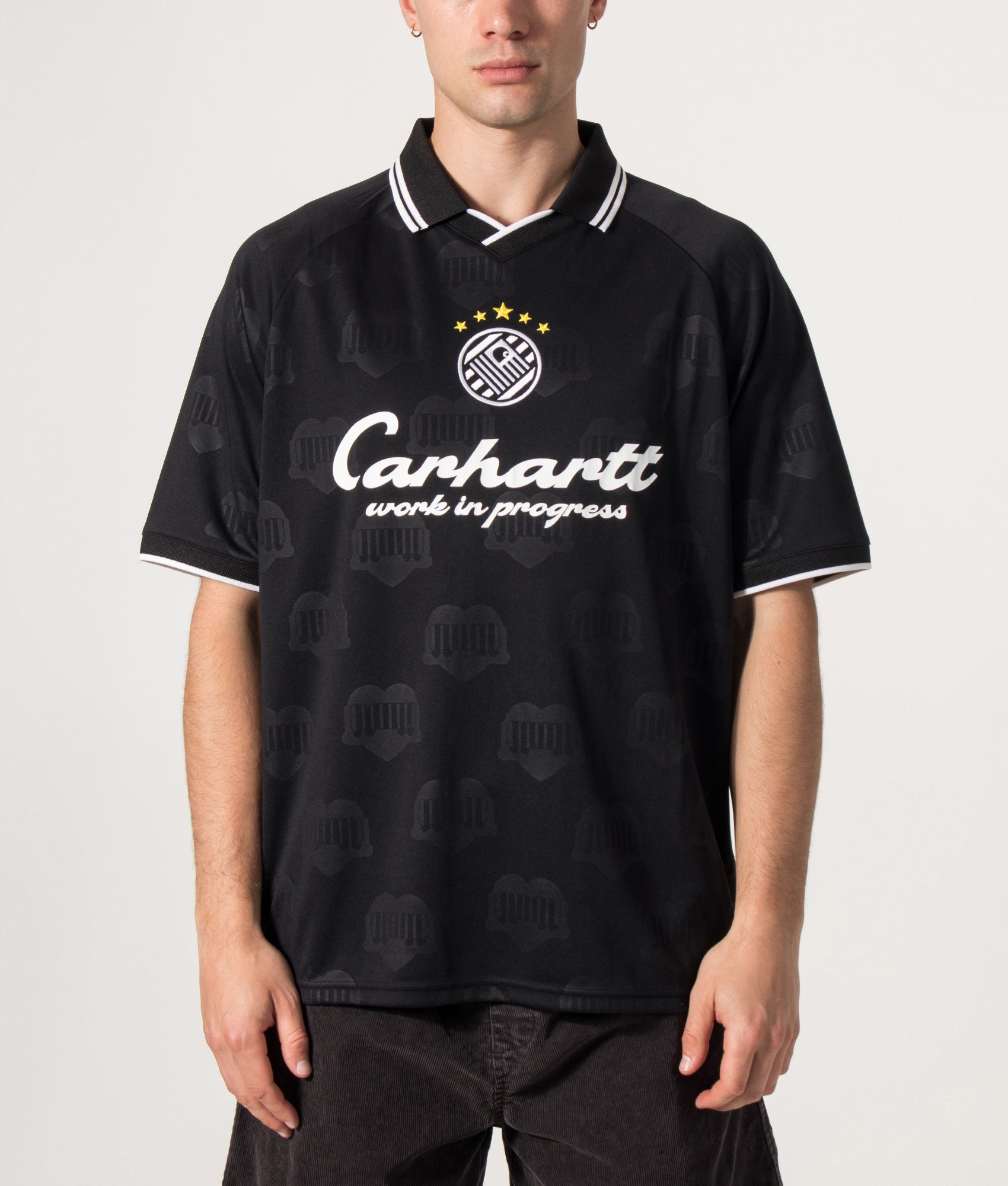 Carhartt WIP Loose Fit Terrace Football T-Shirt in Heart Train Jacquard and Black at EQVVS Menswear. Model front shot.