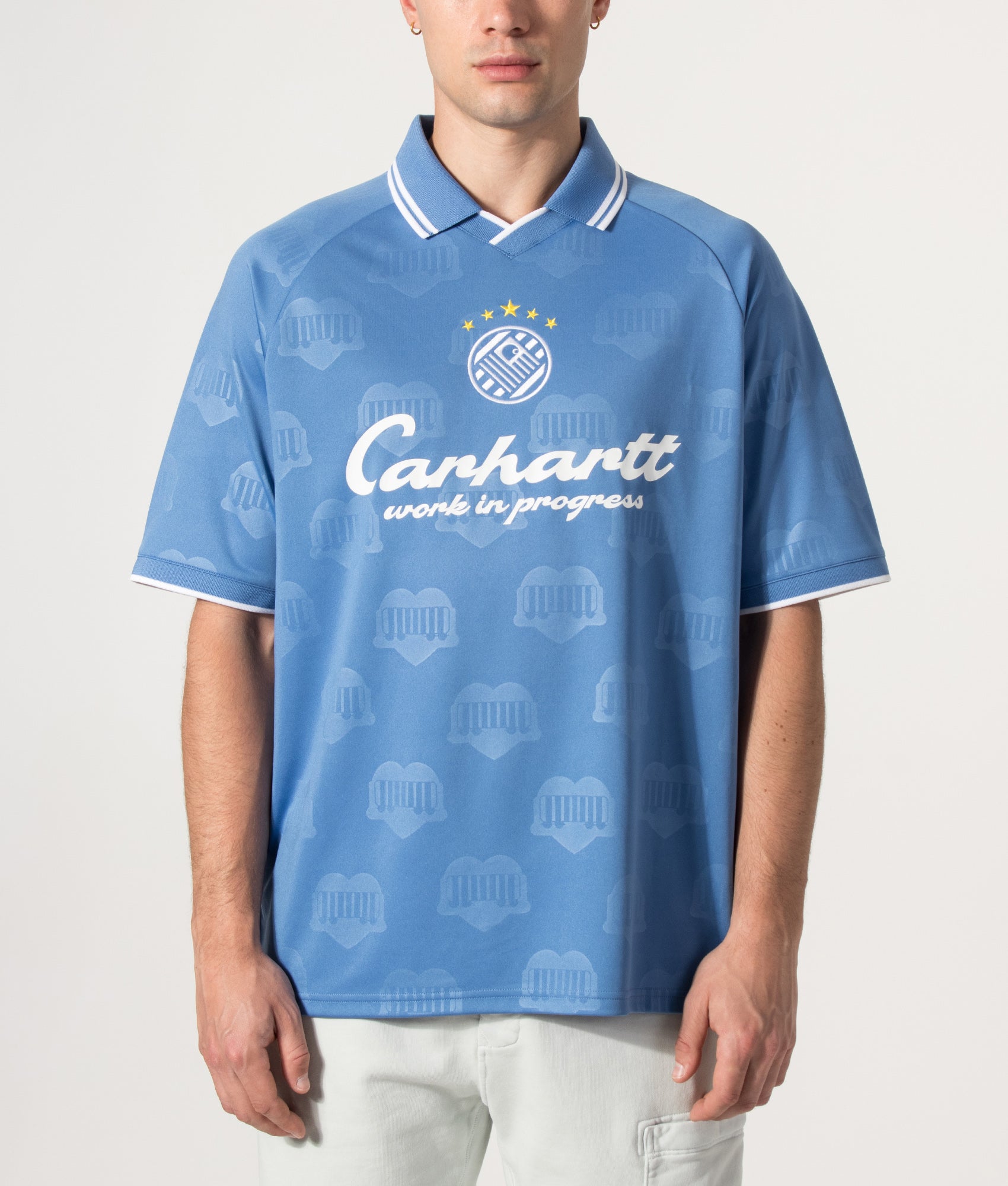 Carhartt WIP Loose Fit Terrace Football T-Shirt in Heart Train Jacquard and Curacao at EQVVS Menswear. Model front shot.
