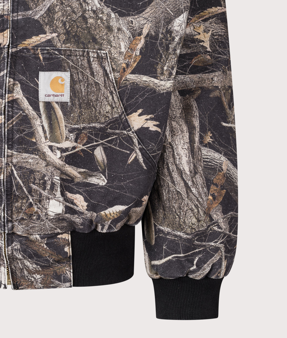 Carhartt WIP Loose Fit OG Active Jacket  in Heavy stone wash Camo Feather Tree/Black at EQVVS Menswear. Detail shot.