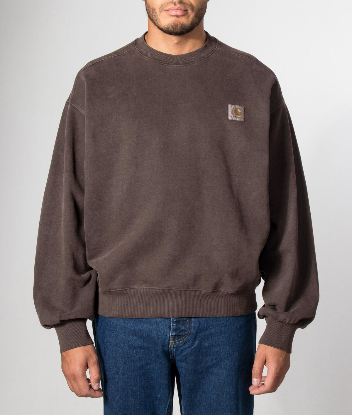 Carhartt WIP Balloon Fit Vista Sweatshirt in Tobacco at EQVVS Menswear. Model front shot.