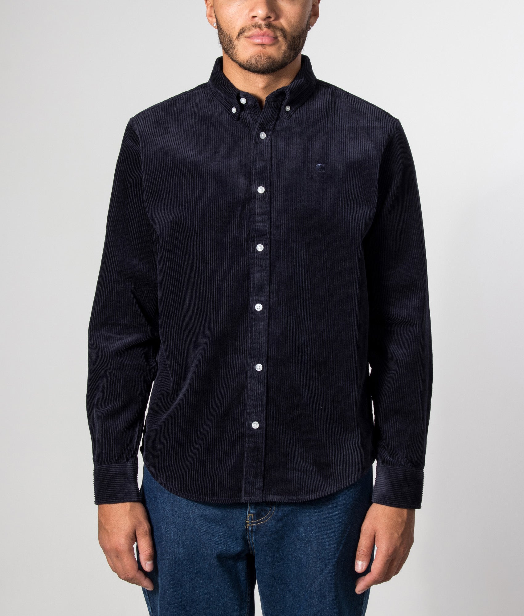 Carhartt WIP Regular Fit Madison Cord Shirt in Dark Navy at EQVVS Menswear. Model front shot.
