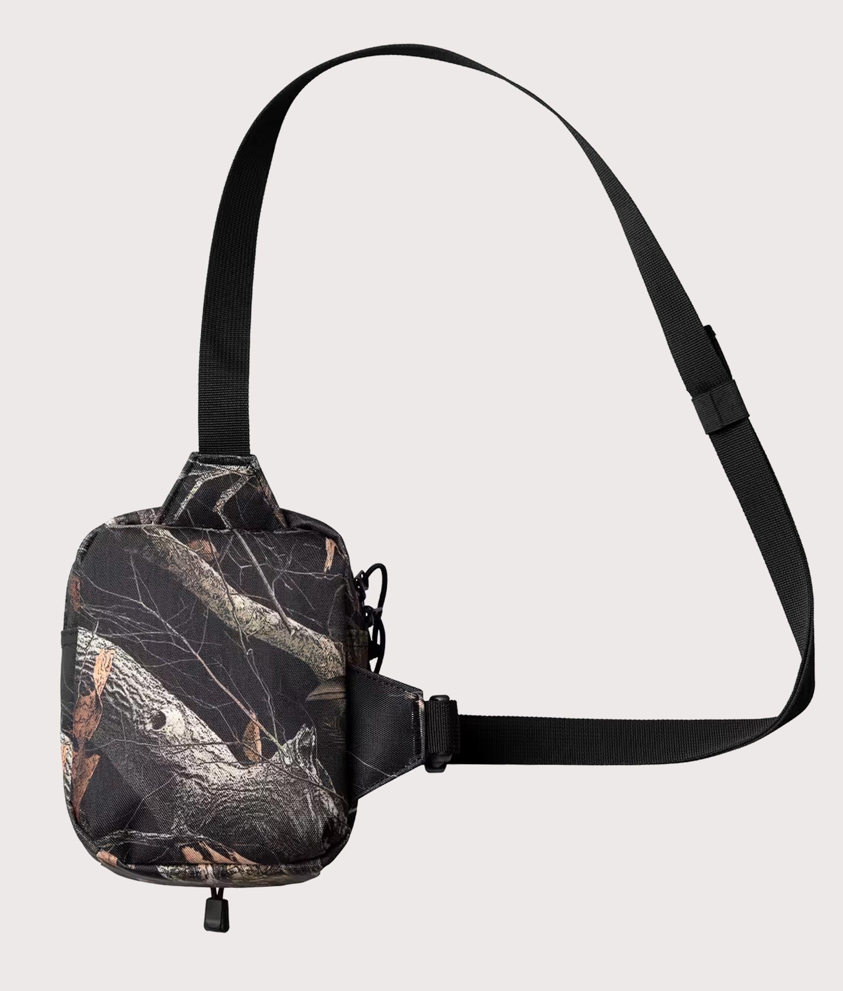 Carhartt WIP Kickflip Shoulder Bag in Camo Feather Tree and Black at EQVVS Menswear. Back shot.