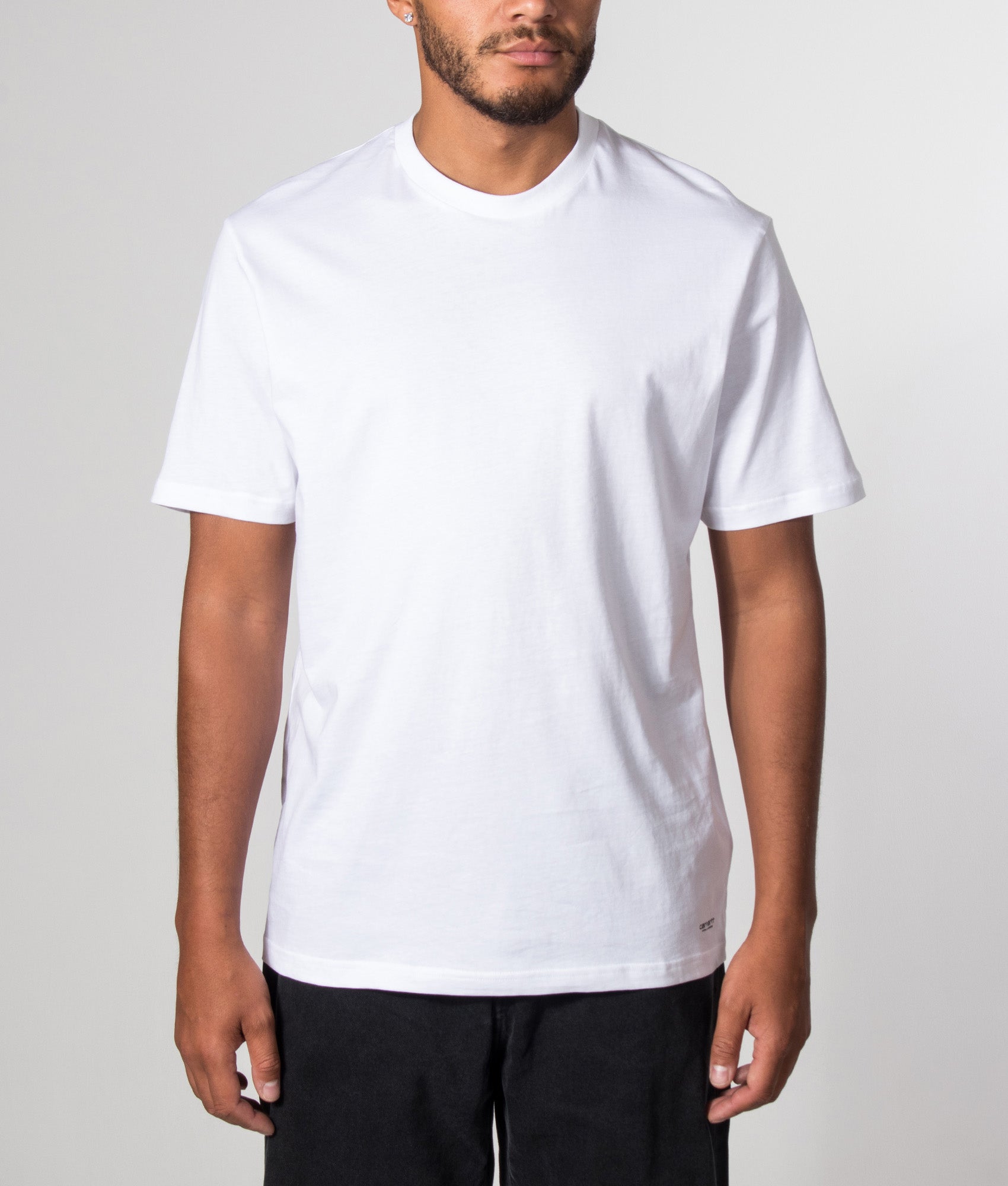 Carhartt WIP 2 Pack Standard Crew Neck T-Shirt in White at EQVVS Menswear.  Model front shot.