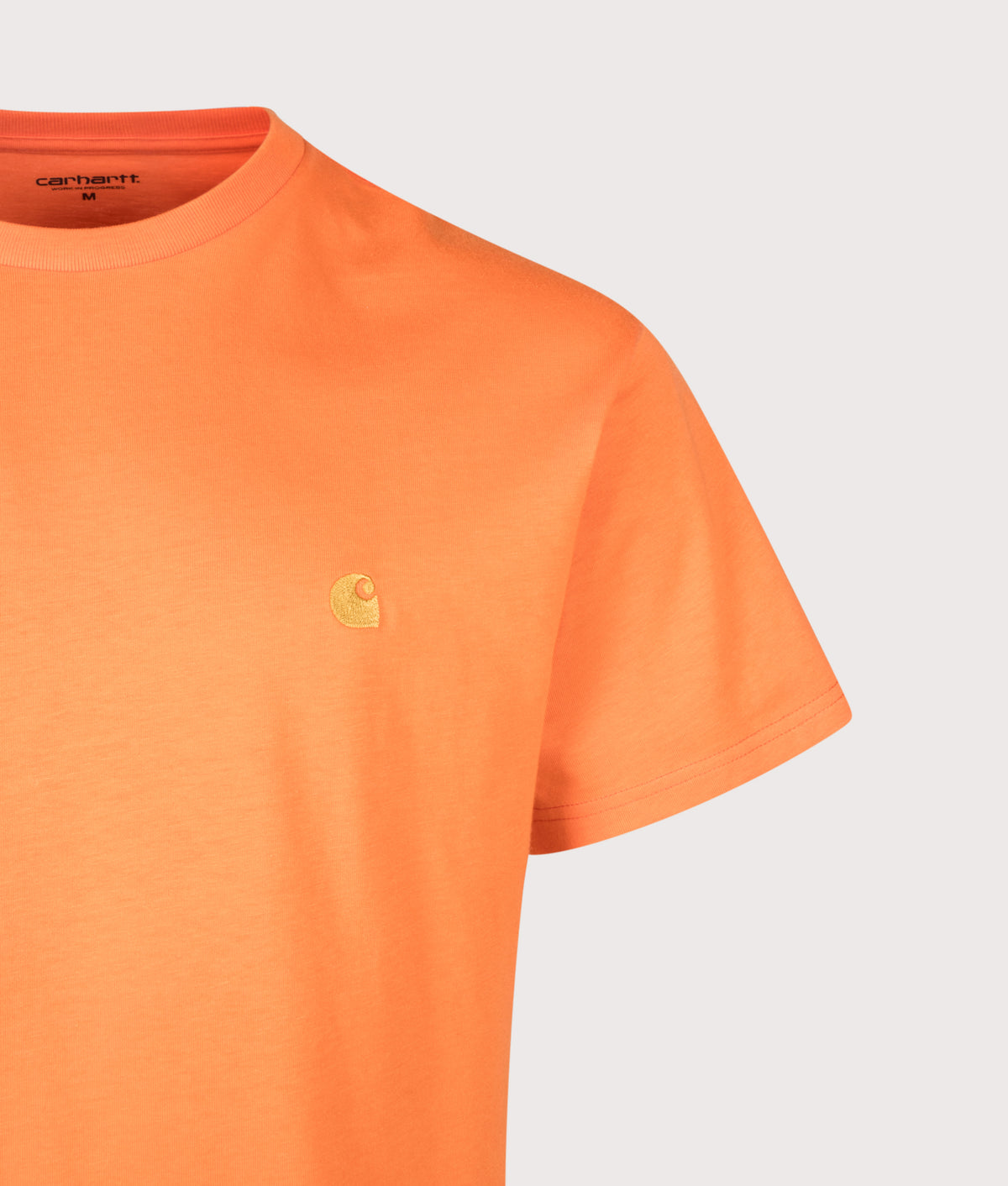Carhartt WIP Loose Fit Chase T-Shirt in Kimba and Gold at EQVVS Menswear. Detail shot.