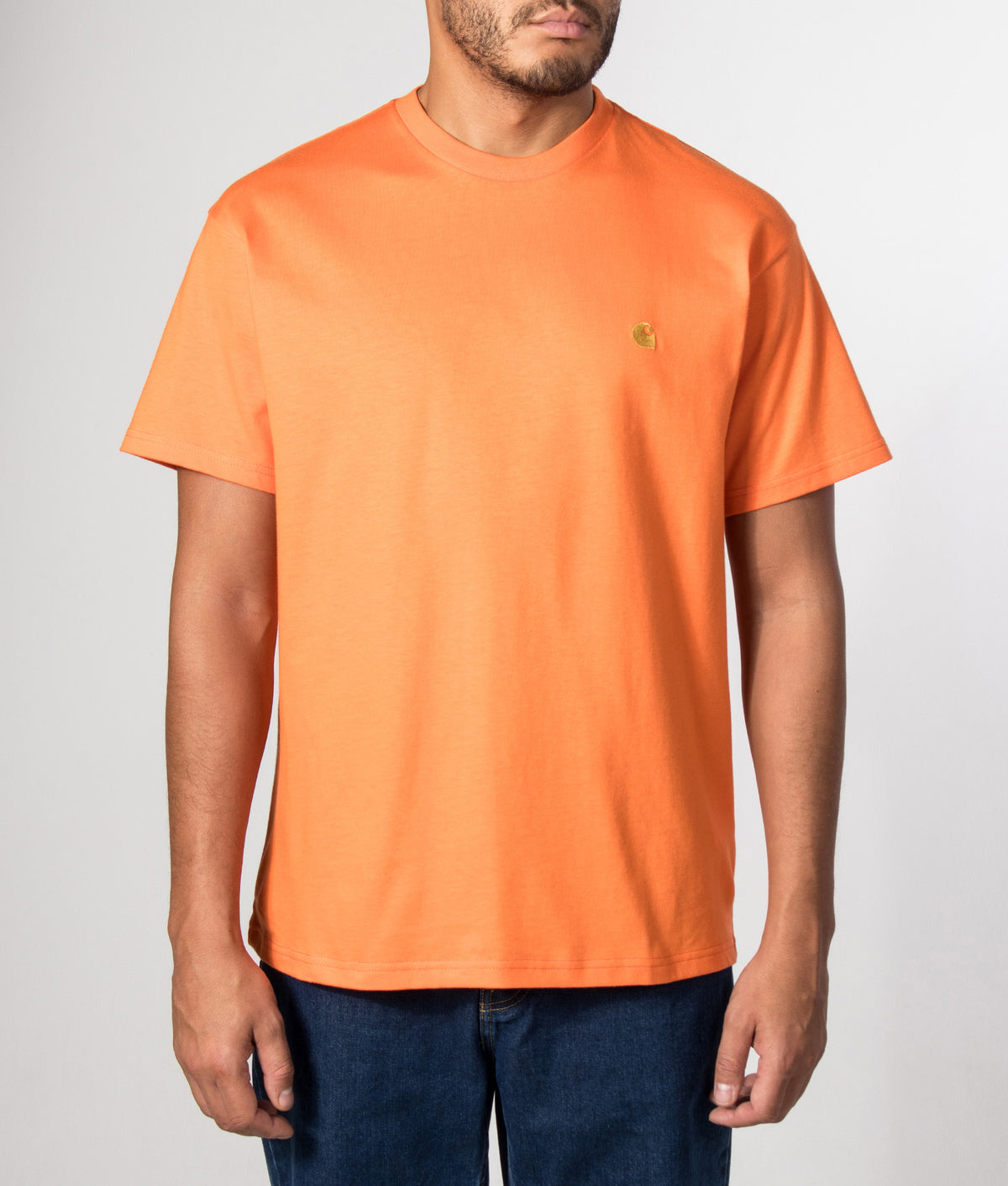 Carhartt WIP Loose Fit Chase T-Shirt in Kimba and Gold at EQVVS Menswear. Model front shot.