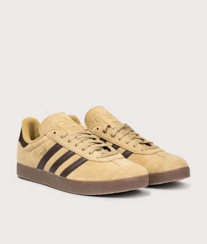 Gazelle Trainers in Gold Beige/Dark Brown/Gold Metallic | adidas Original | EQVVS | Front angle shot 