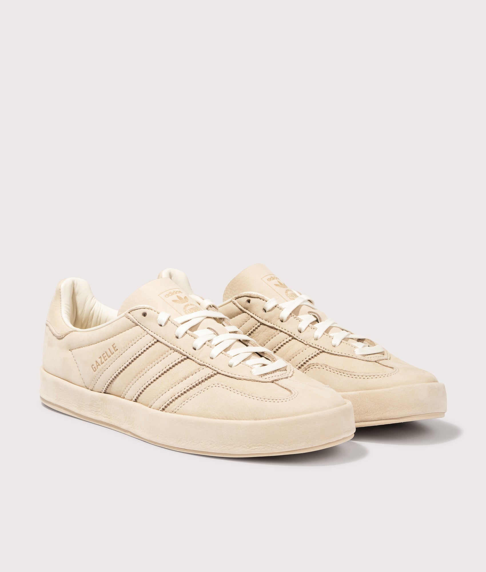 Gazelle Indoor Trainers by adidas in Magic Beige. Shot by EQVVS. Front detail shot.