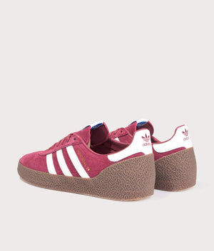 Adidas Montreal 76 Trainers in Noble Maroon/Off White/Gum at EQVVS Menswear. Angled back shot.