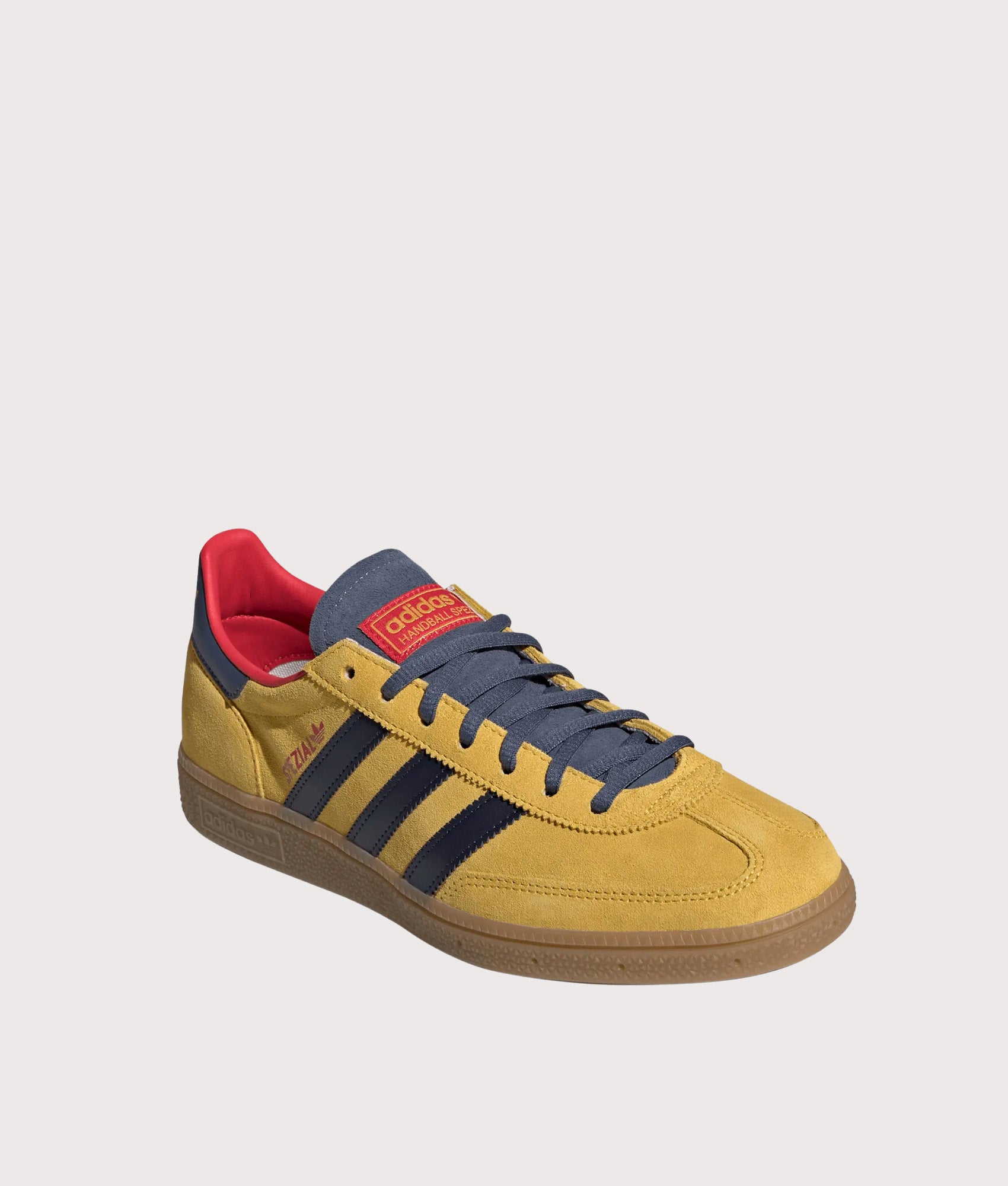 adidas Originals Arsenal FC Handball Spezial Trainers in Hazy yellow, Collegiate Navy and Preloved Ink at EQVVS Menswear.  Angled front shot.