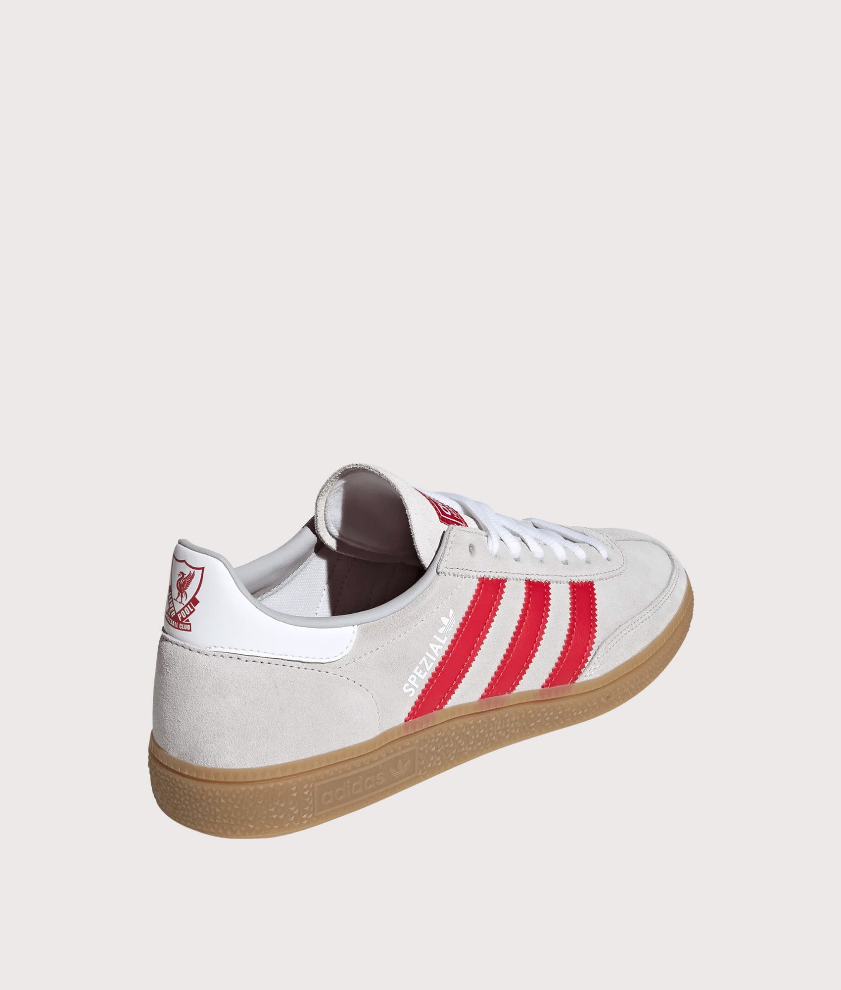 adidas Originals Liverpool FC Handball Spezial Trainers in Grey Two, Strawberry Red and Footwear White at EQVVS Menswear. Angled back shot.