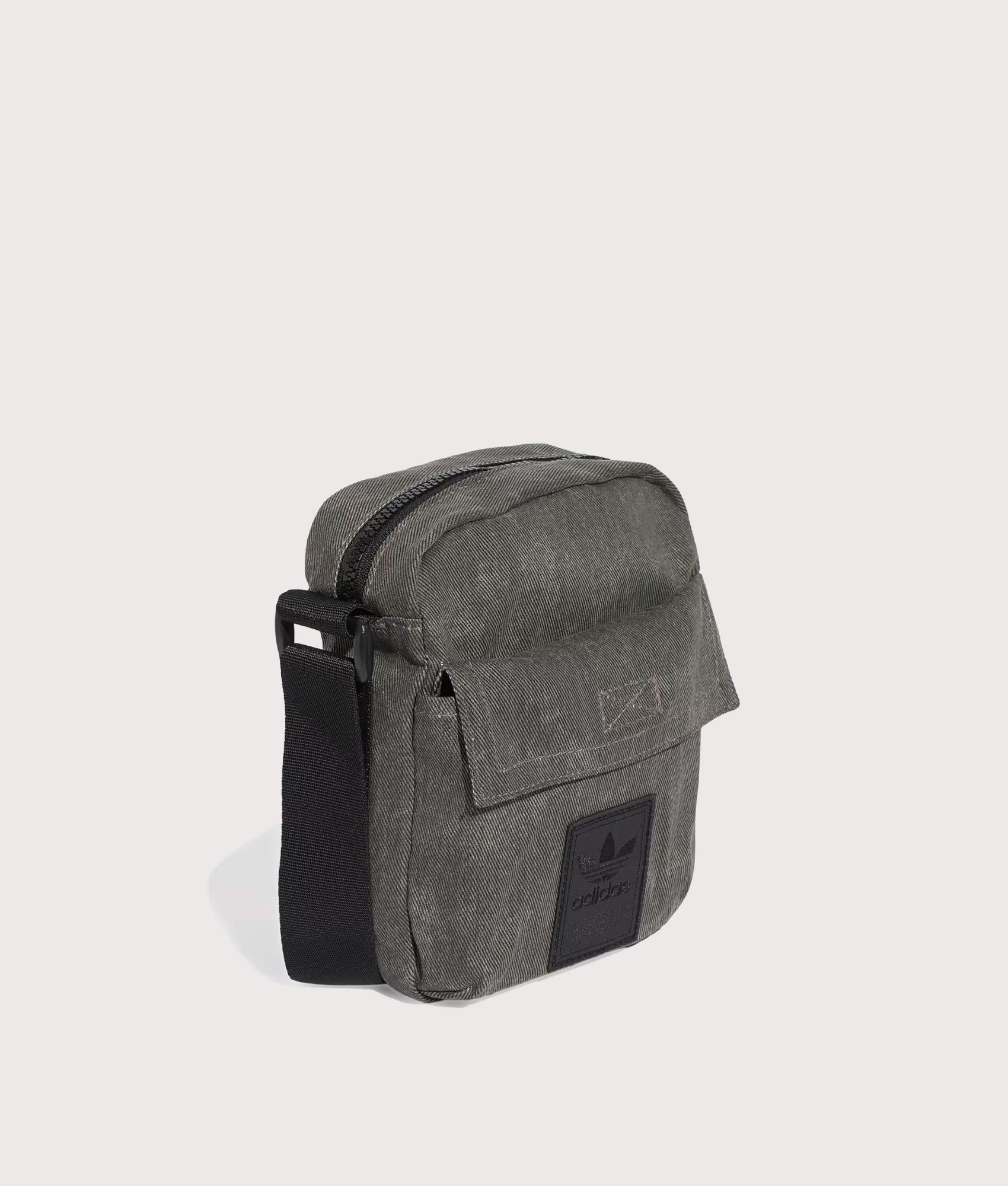 adidas Originals Washed Item Bag in Black at EQVVS Menswear. Angled front shot.