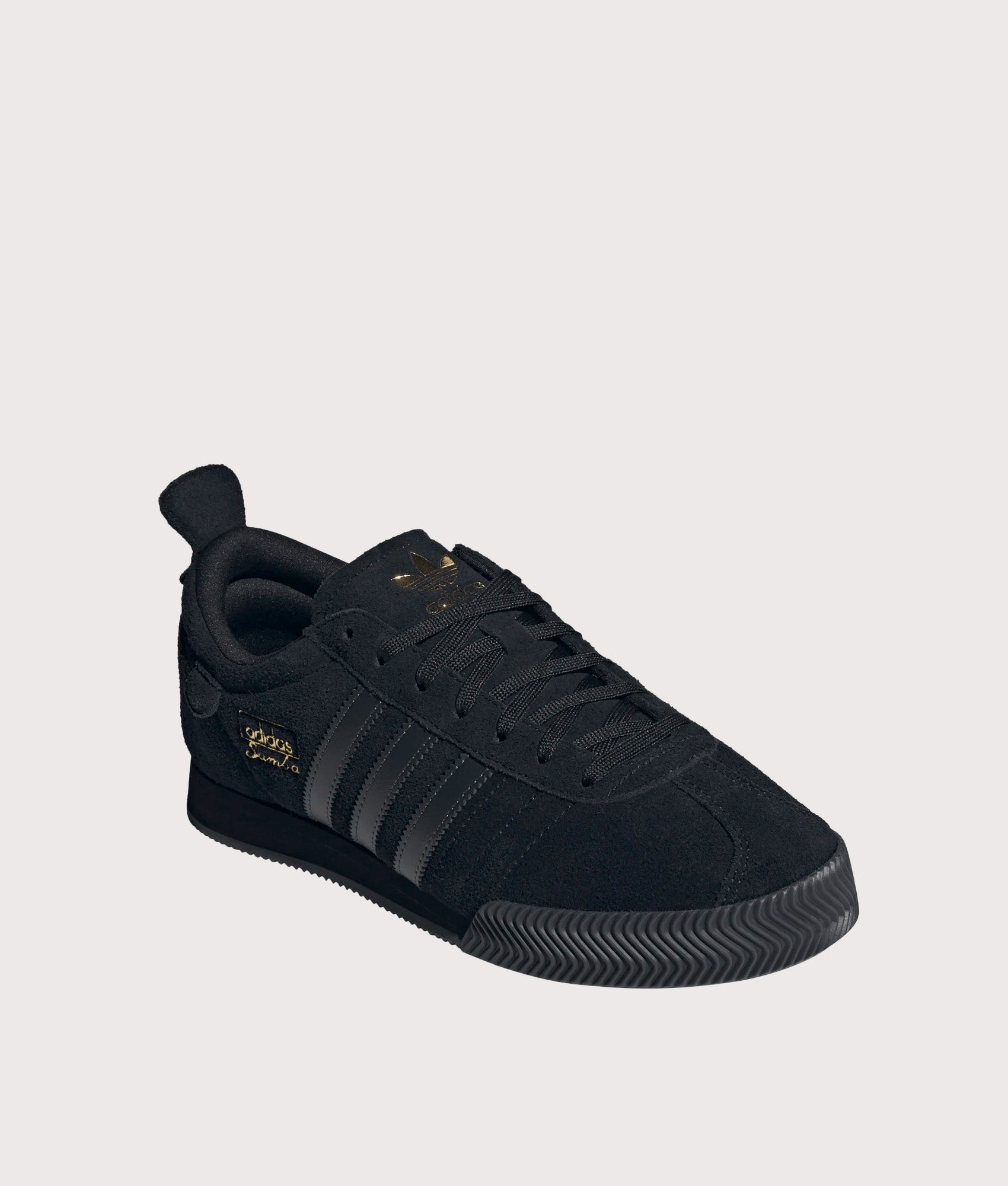 adidas Originals Samba 62 Super Trainers in Core Black and Gold Metallic at EQVVS Menswear. Angled front shot.