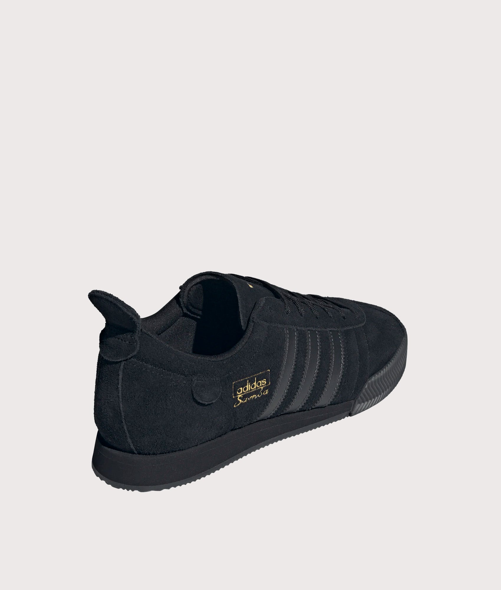 adidas Originals Samba 62 Super Trainers in Core Black and Gold Metallic at EQVVS Menswear. Angled back shot.