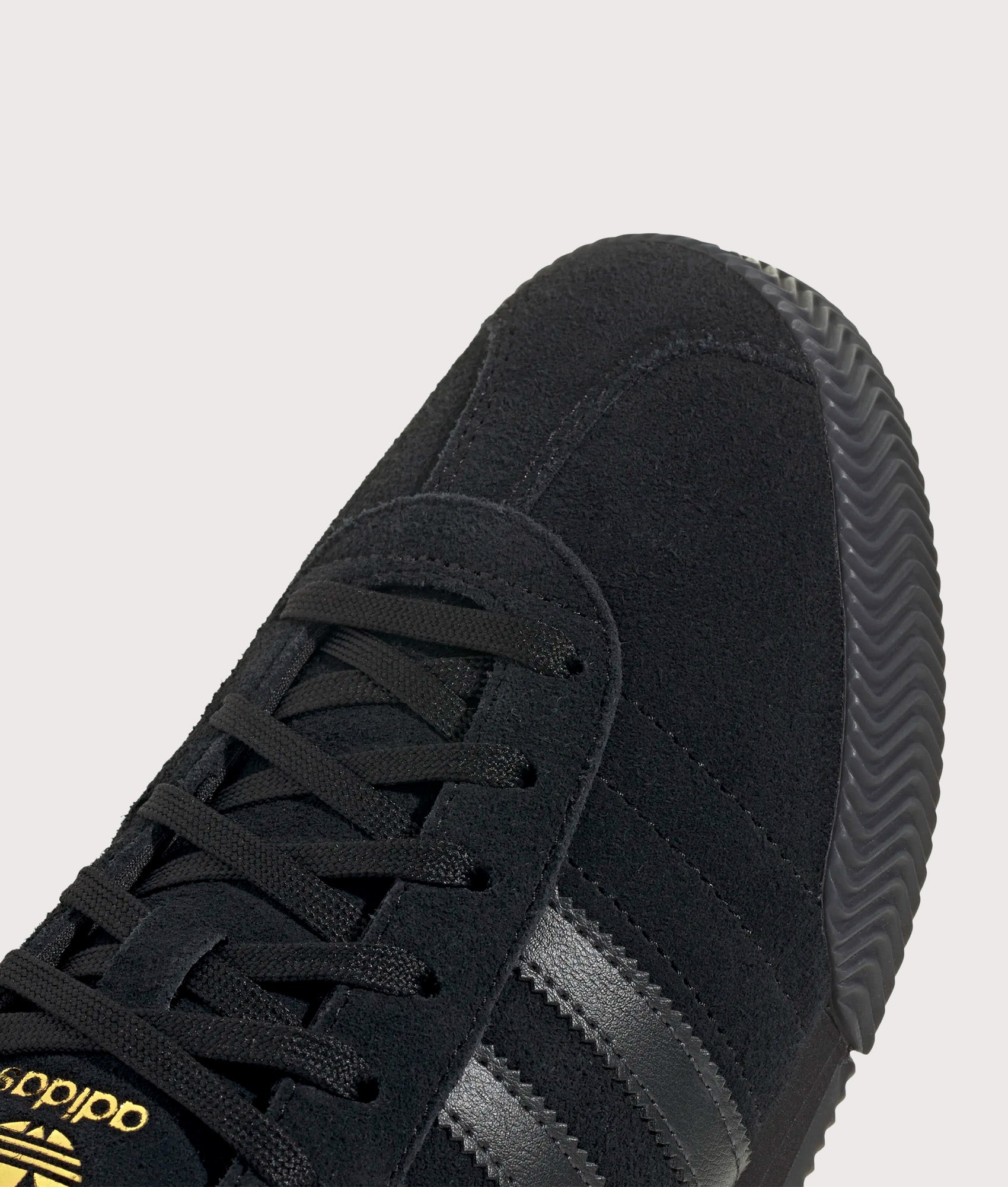 adidas Originals Samba 62 Super Trainers in Core Black and Gold Metallic at EQVVS Menswear. Detail shot.