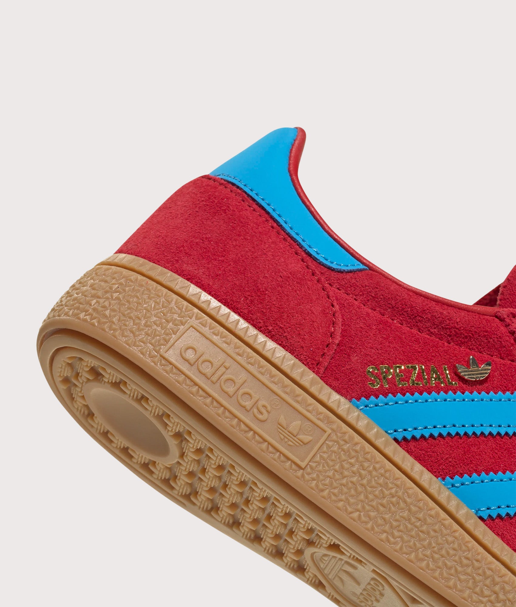 adidas Originals Handball Spezial Trainers in Better Scarlet, Lucid Aqua and Gold Metallic at EQVVS Menswear. Detail shot.