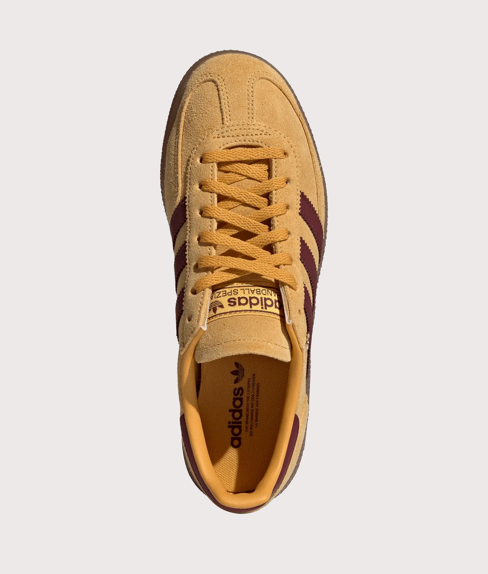 adidas Originals Handball Spezial Trainers in Preloved Yellow, Shadow Red and Gold Metallic at EQVVS Menswear.  Top shot.