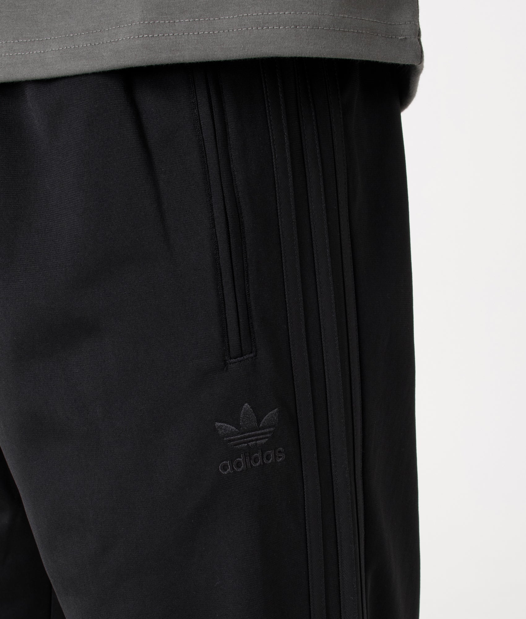 adidas Originals Fire Bird Track Pants at EQVVS Menswear. Detail shot.