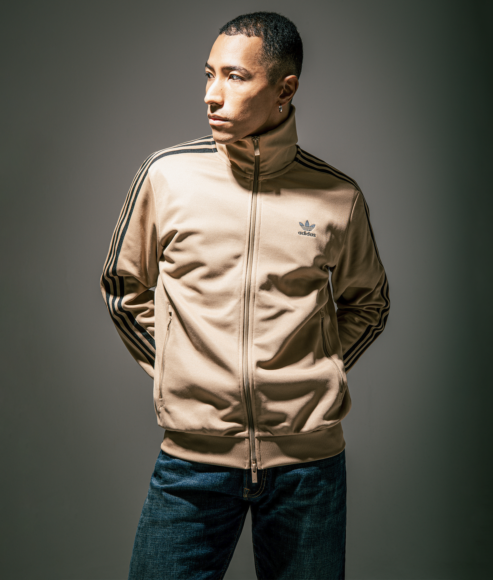 Adidas Classic Track Top in Cardboard/Black at EQVVS Menswear. Campaign shot.