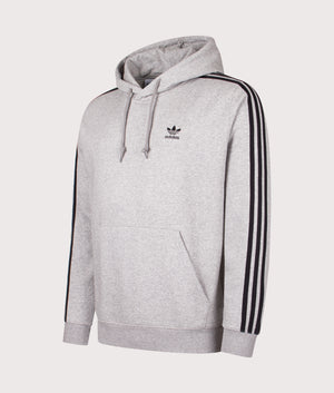 Adicolour 3 Stripes Hoodie. Shot by EQVVS. Front angled shot.