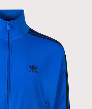Firebird Track Top by adidas Originals in Blue/Black. Shot by EQVVS. Detail Shot.