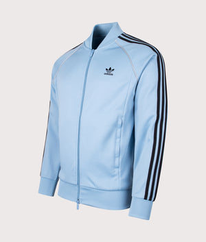 SST Track Top by adidas Originals in Sky Blue/White. Shot by EQVVS. Front  angled shot.