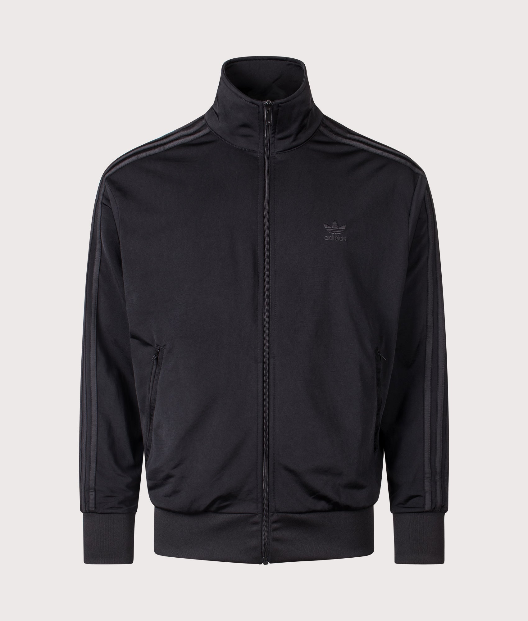 Firebird Track Top by adidas Originals in Black/Black. Shot by EQVVS. Front shot.