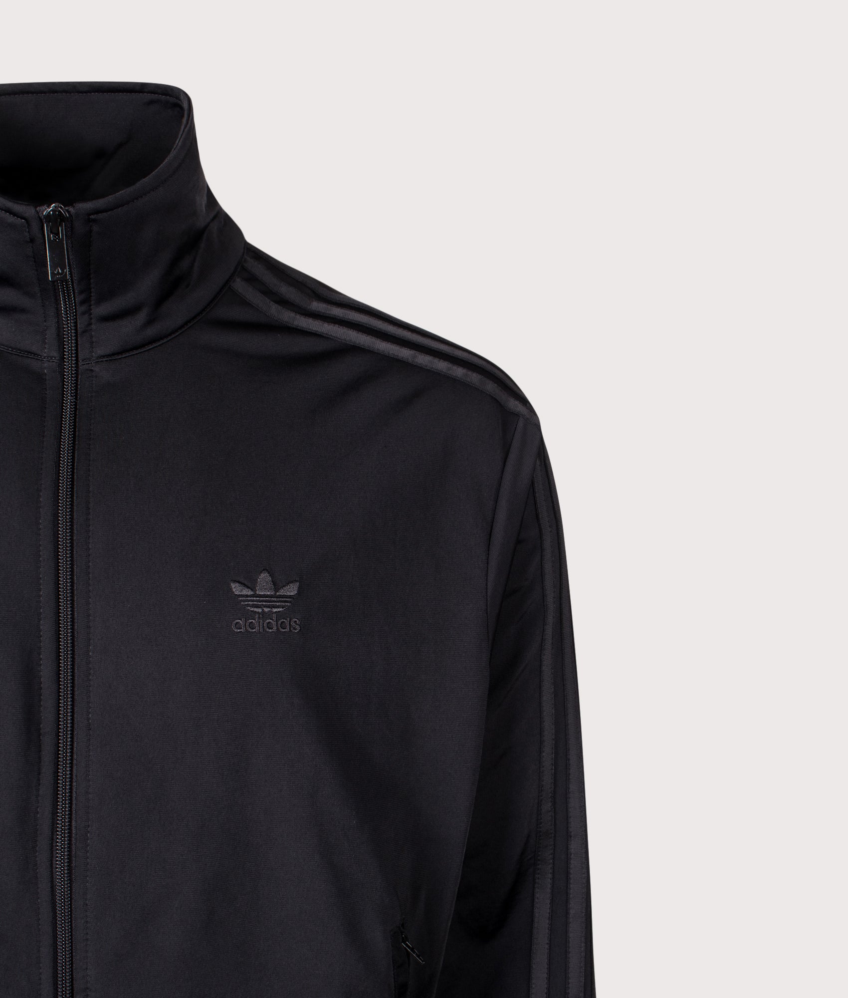 Firebird Track Top by adidas Originals in Black/Black. Shot by EQVVS. Detail shot.