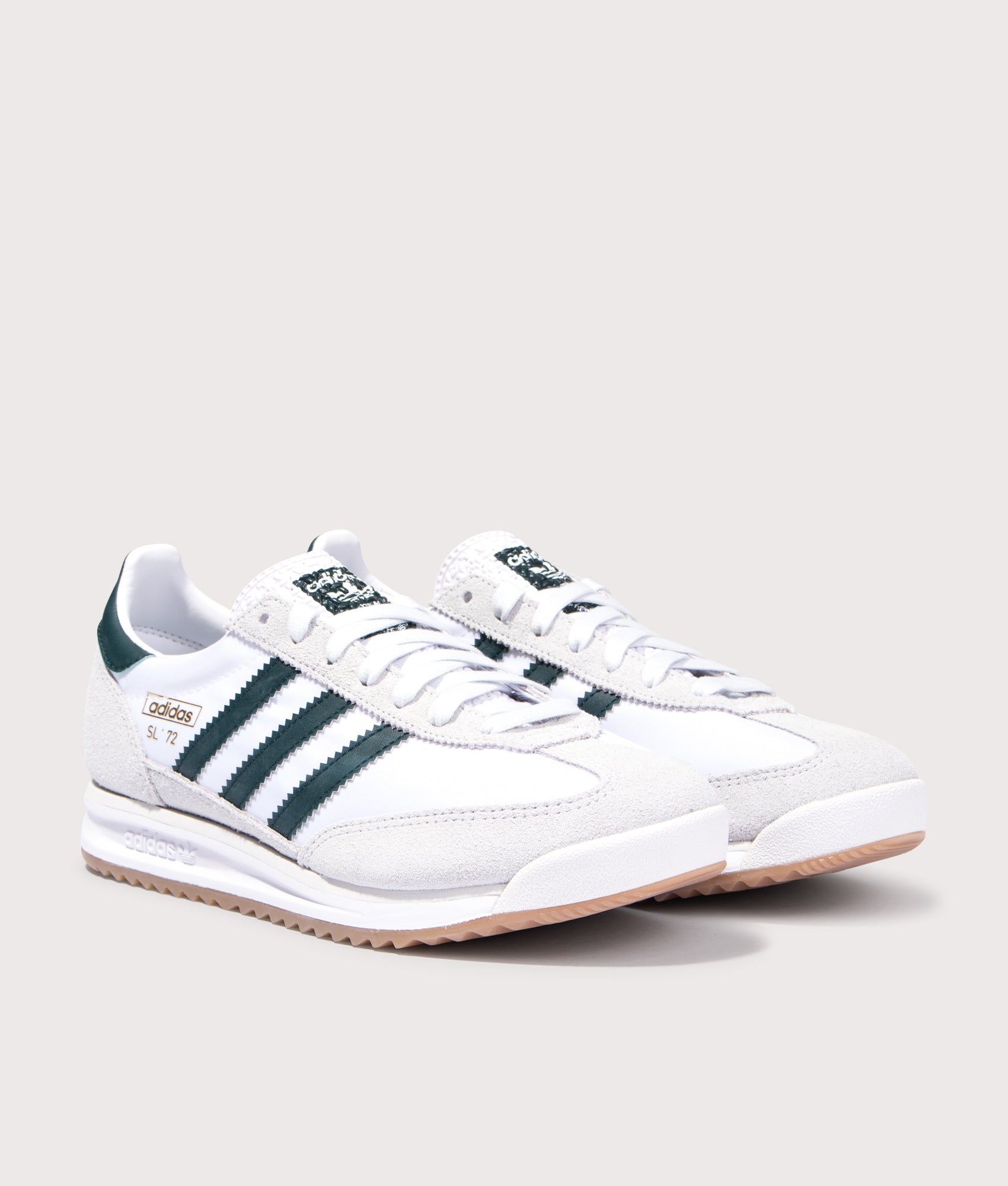 SL 72 RS Trainers return in Cloud White/Aurora Ivy/Crystal White | adidas Original | EQVVS | Front angle shot 