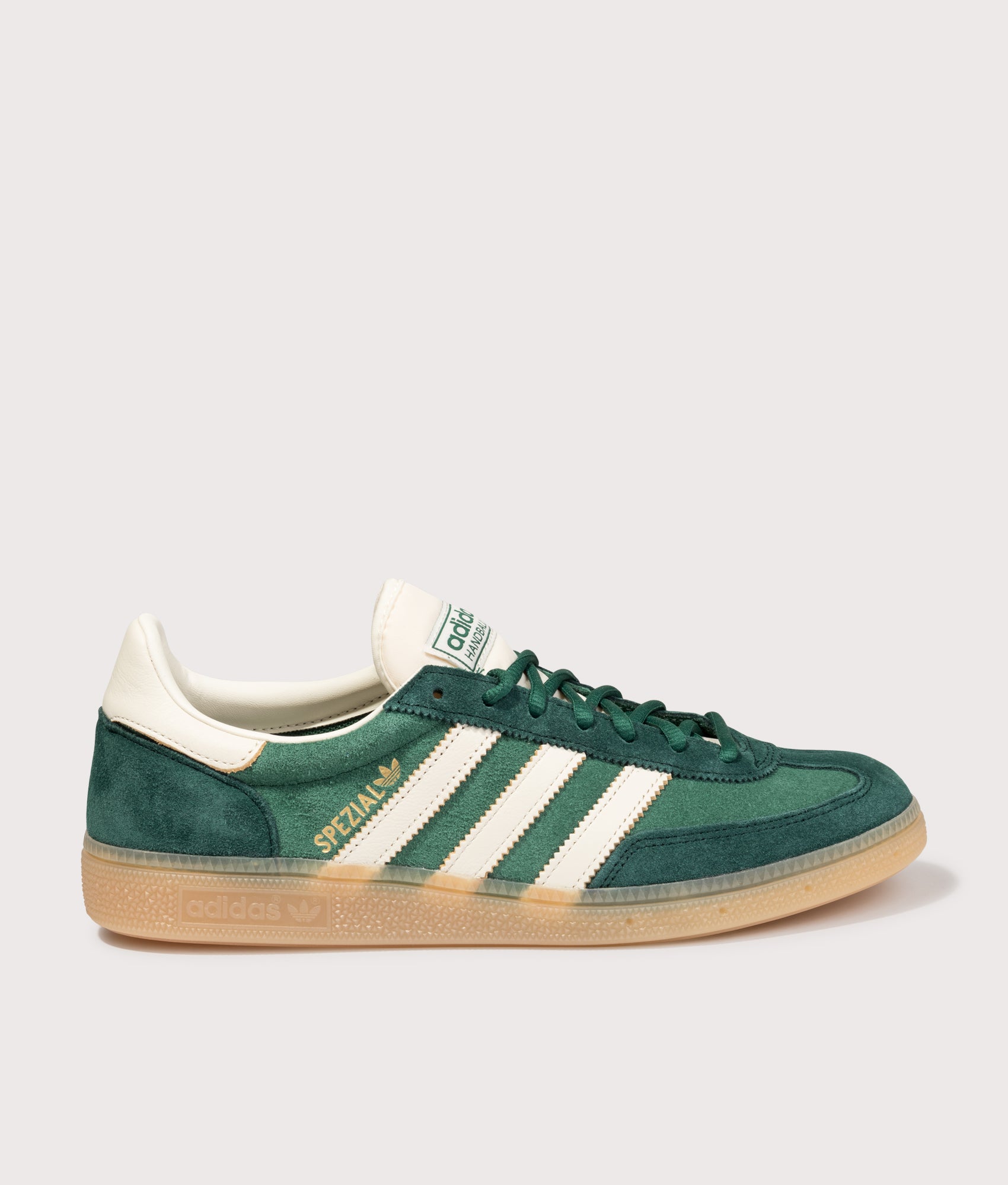 adidas Originals Handball Spezial Trainers in Collegiate Green/Off White/Aurora Ivy at EQVVS Menswear. Side shot.