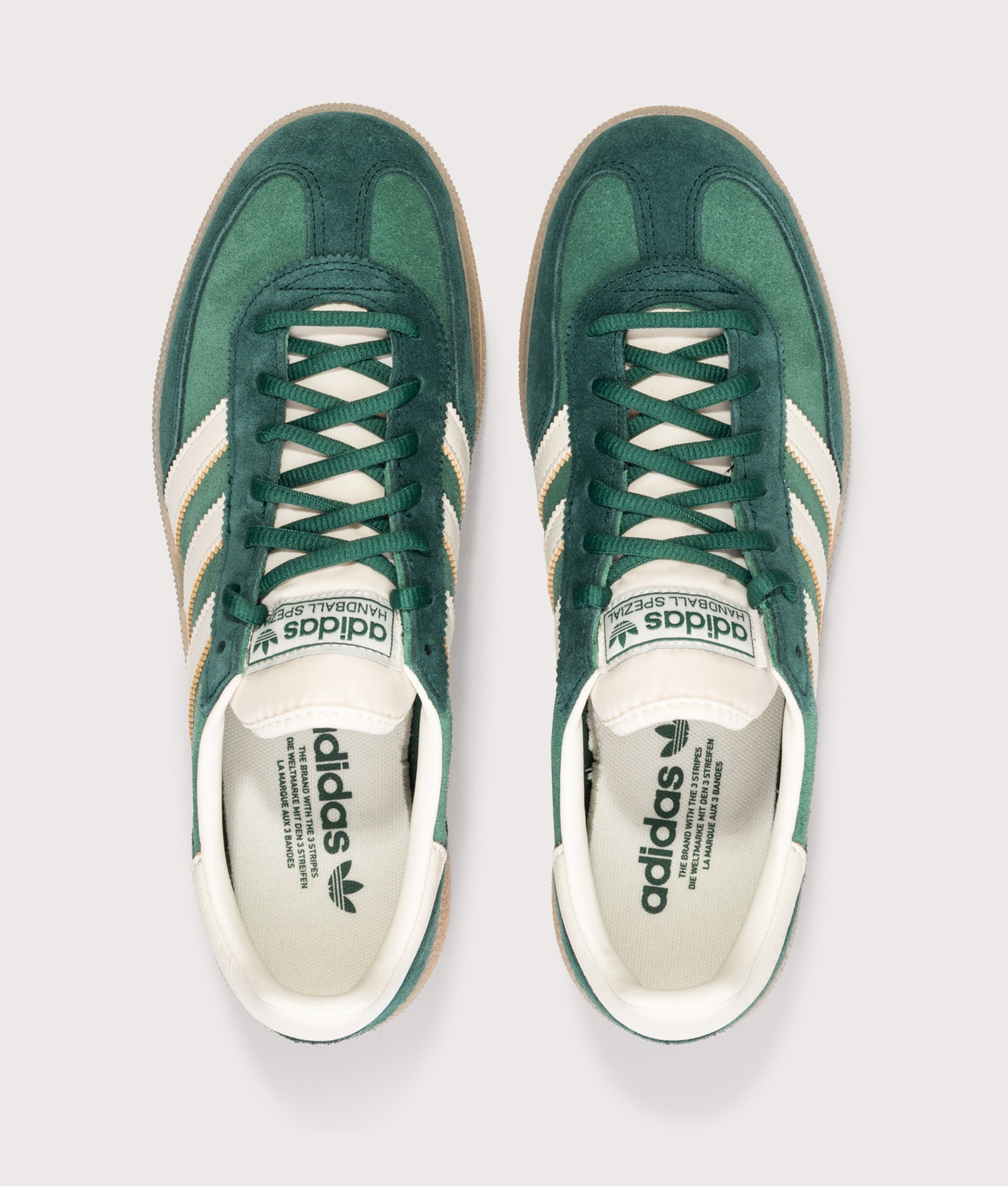 adidas Originals Handball Spezial Trainers in Collegiate Green/Off White/Aurora Ivy at EQVVS Menswear.  Top shot.