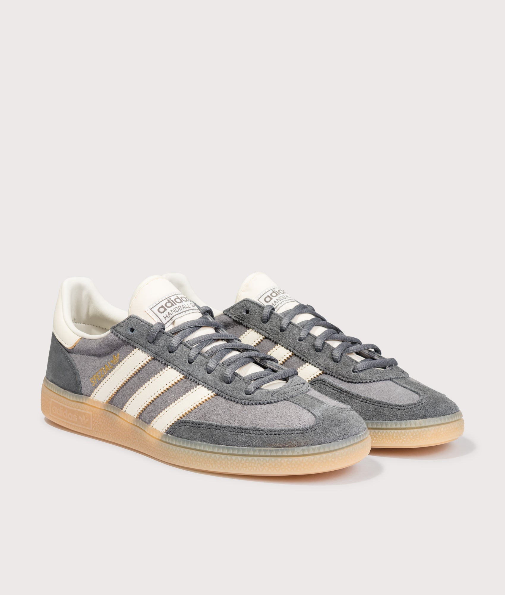 adidas Originals Handball Spezial Trainers in Grey Four, Off White and Grey Six at EQVVS Menswear. Angled front shot.