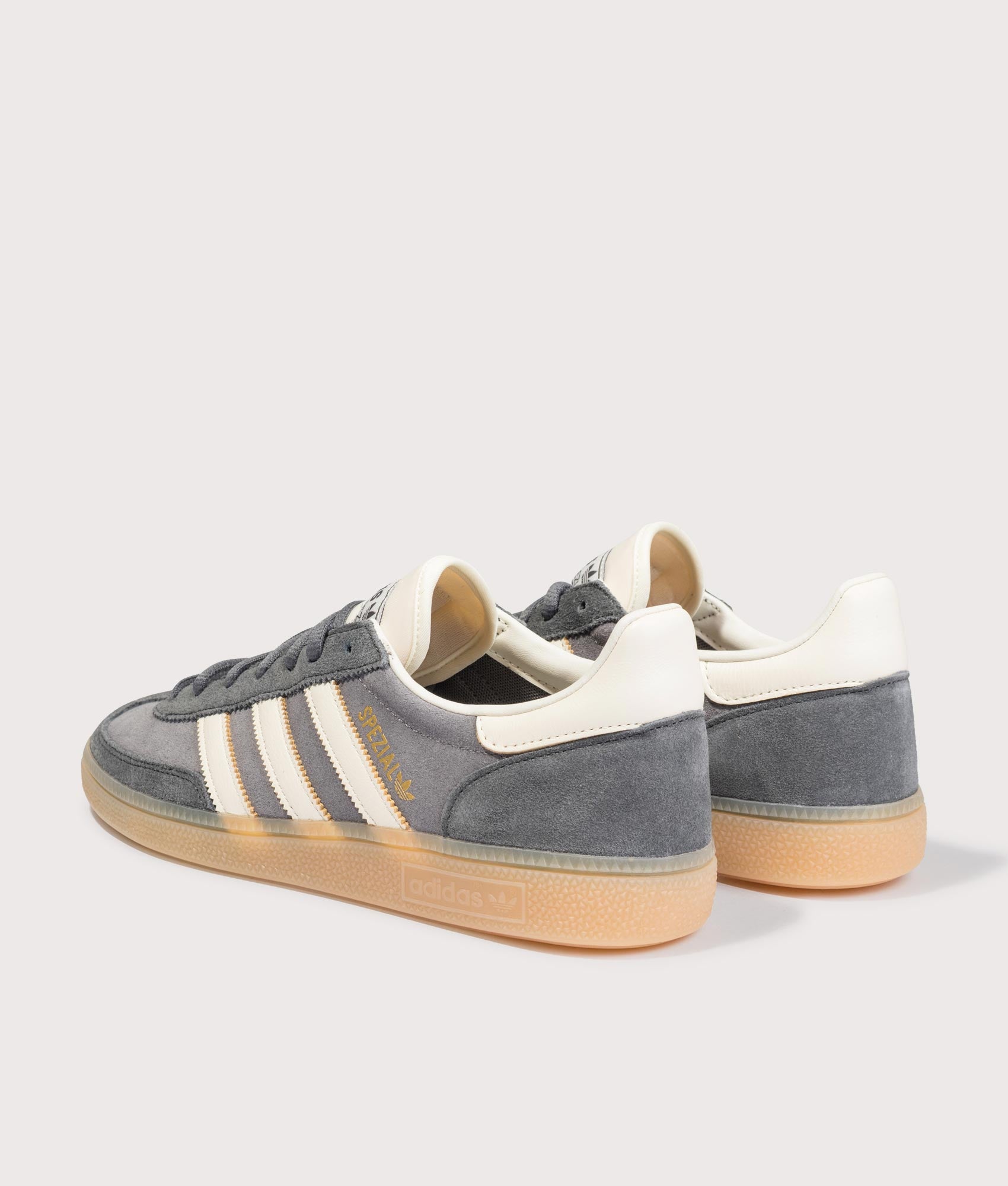 adidas Originals Handball Spezial Trainers in Grey Four, Off White and Grey Six at EQVVS Menswear. Angled back shot.