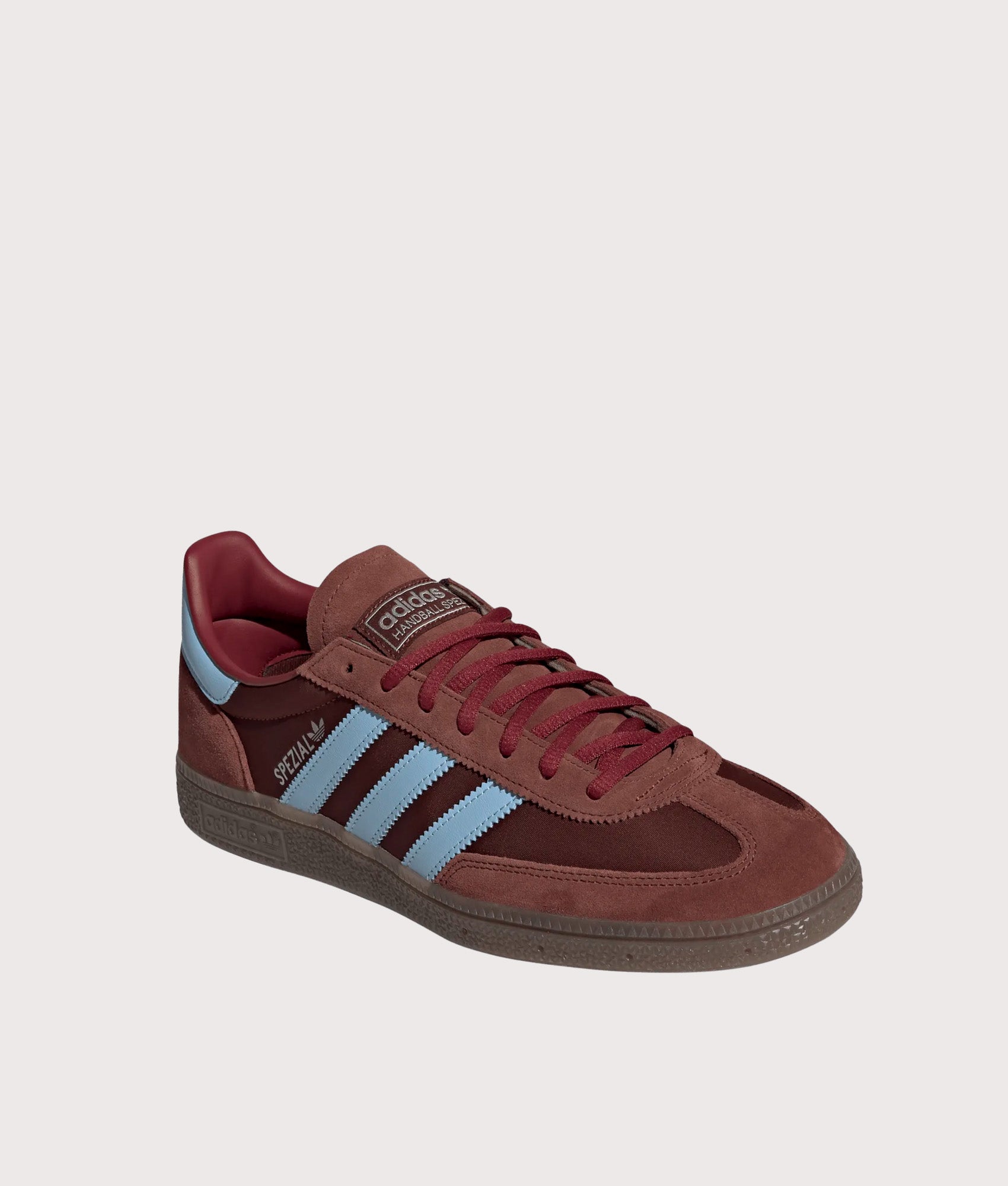 adidas Originals Handball Spezial Trainers in Fox Brown, Clear Sky and Gum 5 at EQVVS Menswear. Angled front shot.
