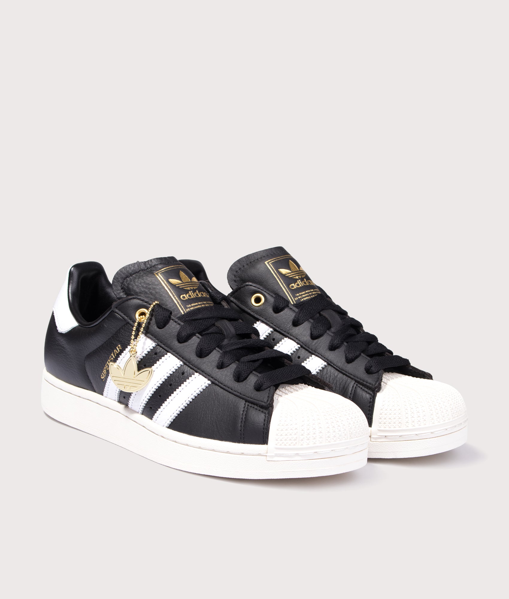 adidas Originals Superstar II Trainers in Core Black, Cloud White and Off White at EQVVS Menswear. Angled front shot. 