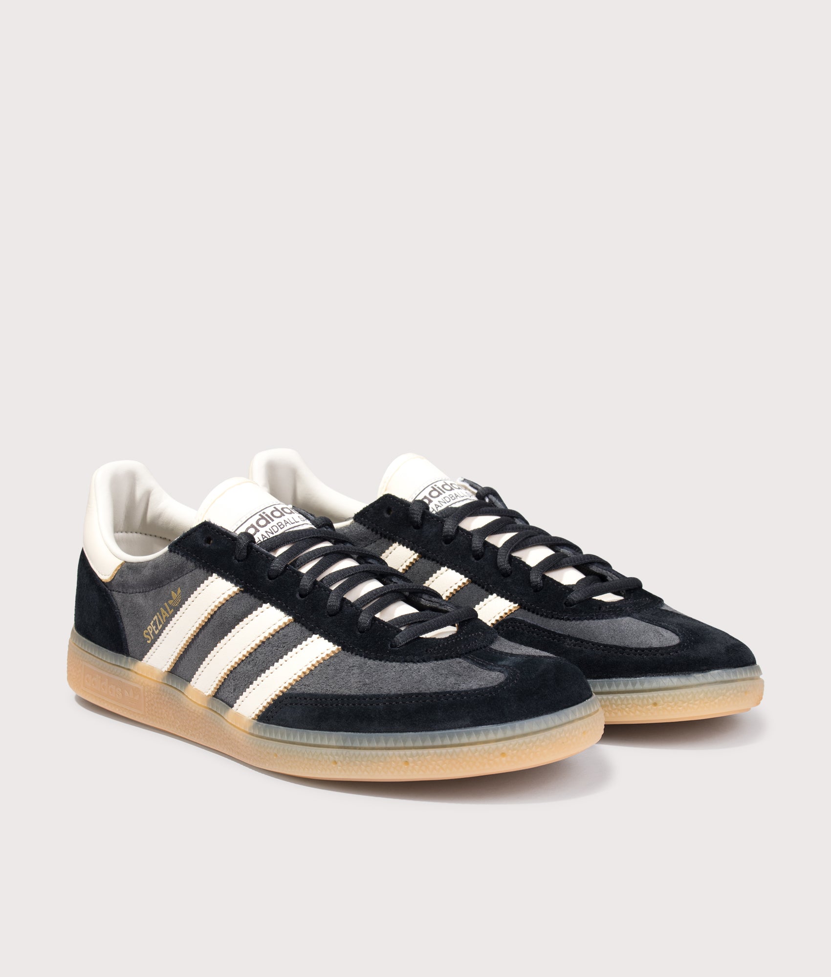 adidas Originals Handball Spezial Trainers in Carbon/Off White/Core Black at EQVVS Menswear. Angled front shot.