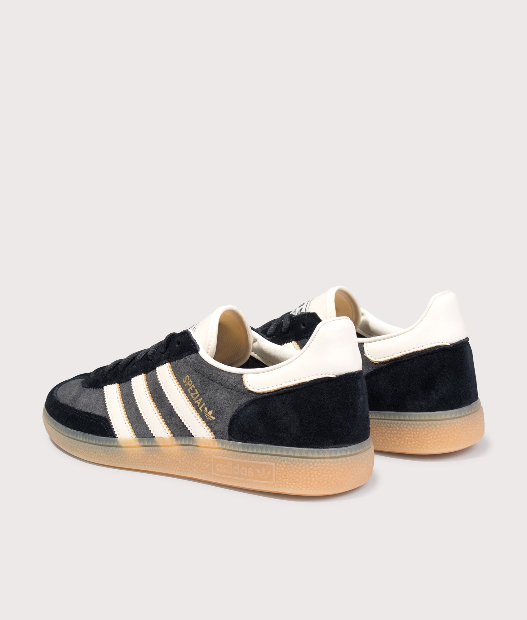 adidas Originals Handball Spezial Trainers in Carbon/Off White/Core Black at EQVVS Menswear. Angled back shot.