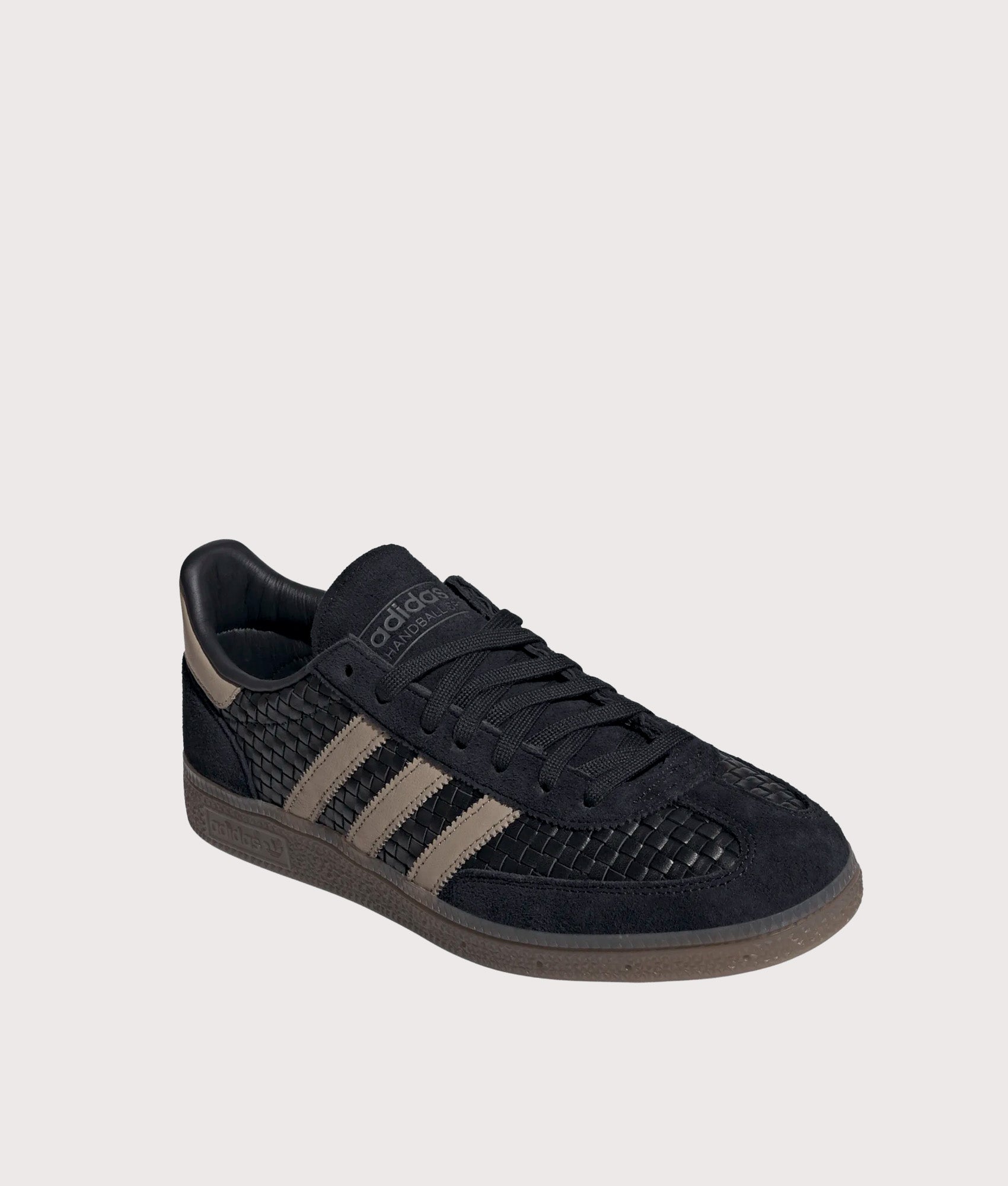adidas Originals Basket Weave Handball Spezial Trainers in Core Black, Trace Khaki and Gum 5 at EQVVS Menswear. Angled front shot.