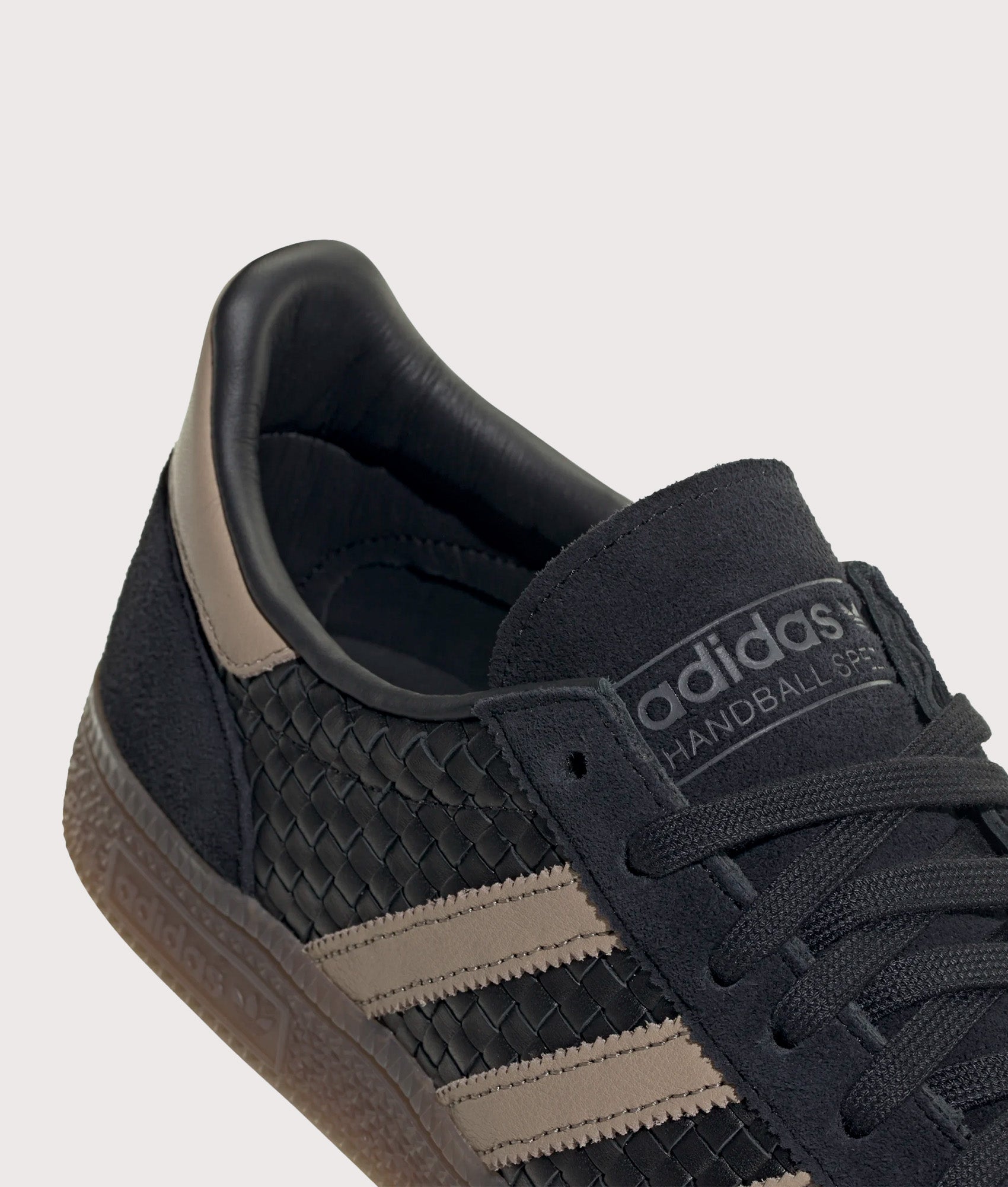 adidas Originals Basket Weave Handball Spezial Trainers in Core Black, Trace Khaki and Gum 5 at EQVVS Menswear. Detail shot.