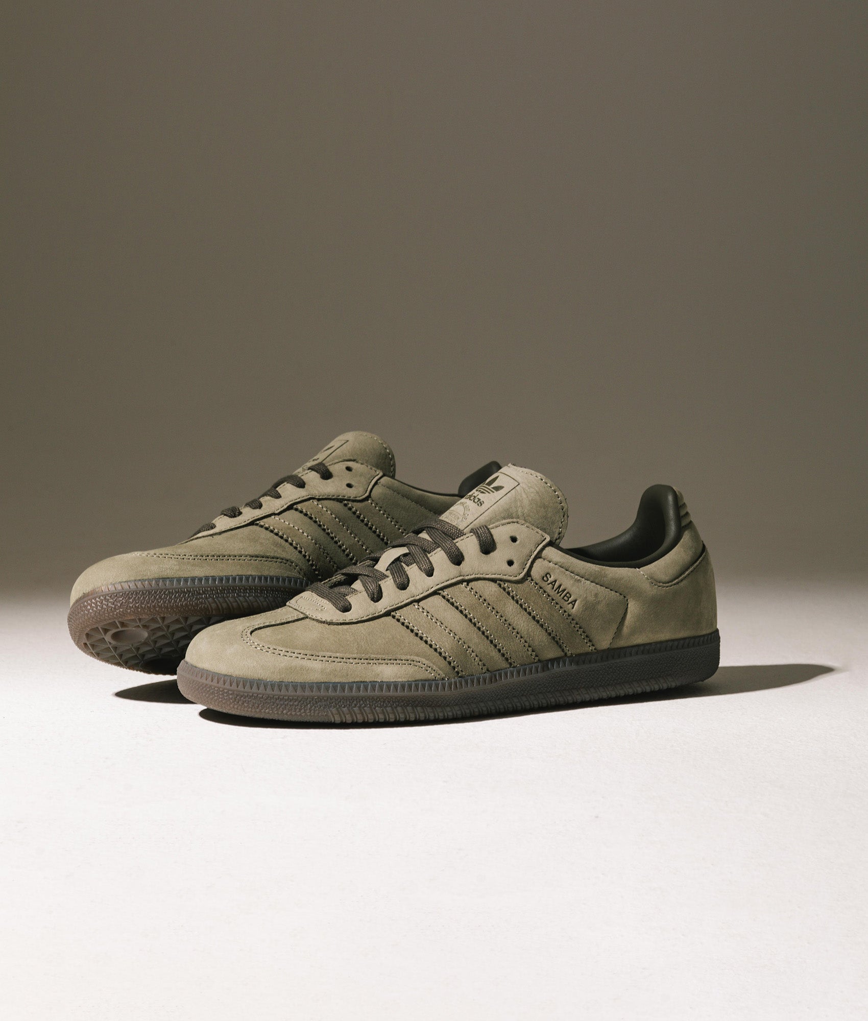 adidas Originals Samba OG Trainers in Clay/Shadow Olive/Gum5 at EQVVS Menswear. Campaign shot.