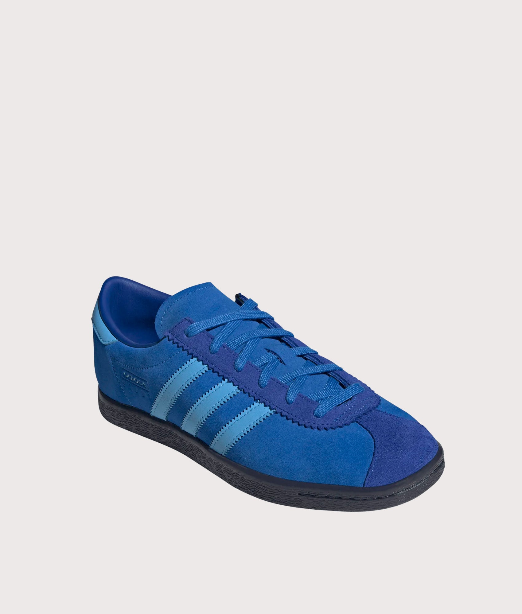 adidas Originals Stadt Trainers in Bright Royal, Semi Blue Burst and Shadow Navy at EQVVS Menswear. Angled front shot.
