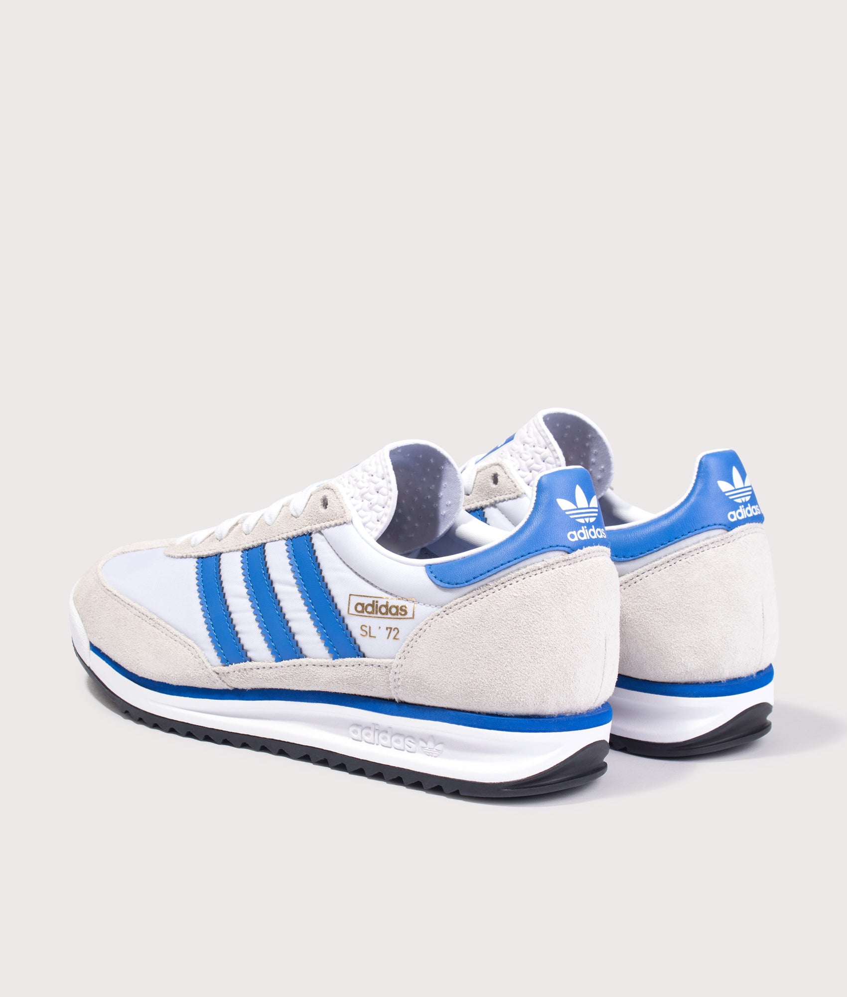 adidas Originals SL 72 RS Trainers in Footwear White, Blue and Core Black at EQVVS Menswear. Angled back shot.