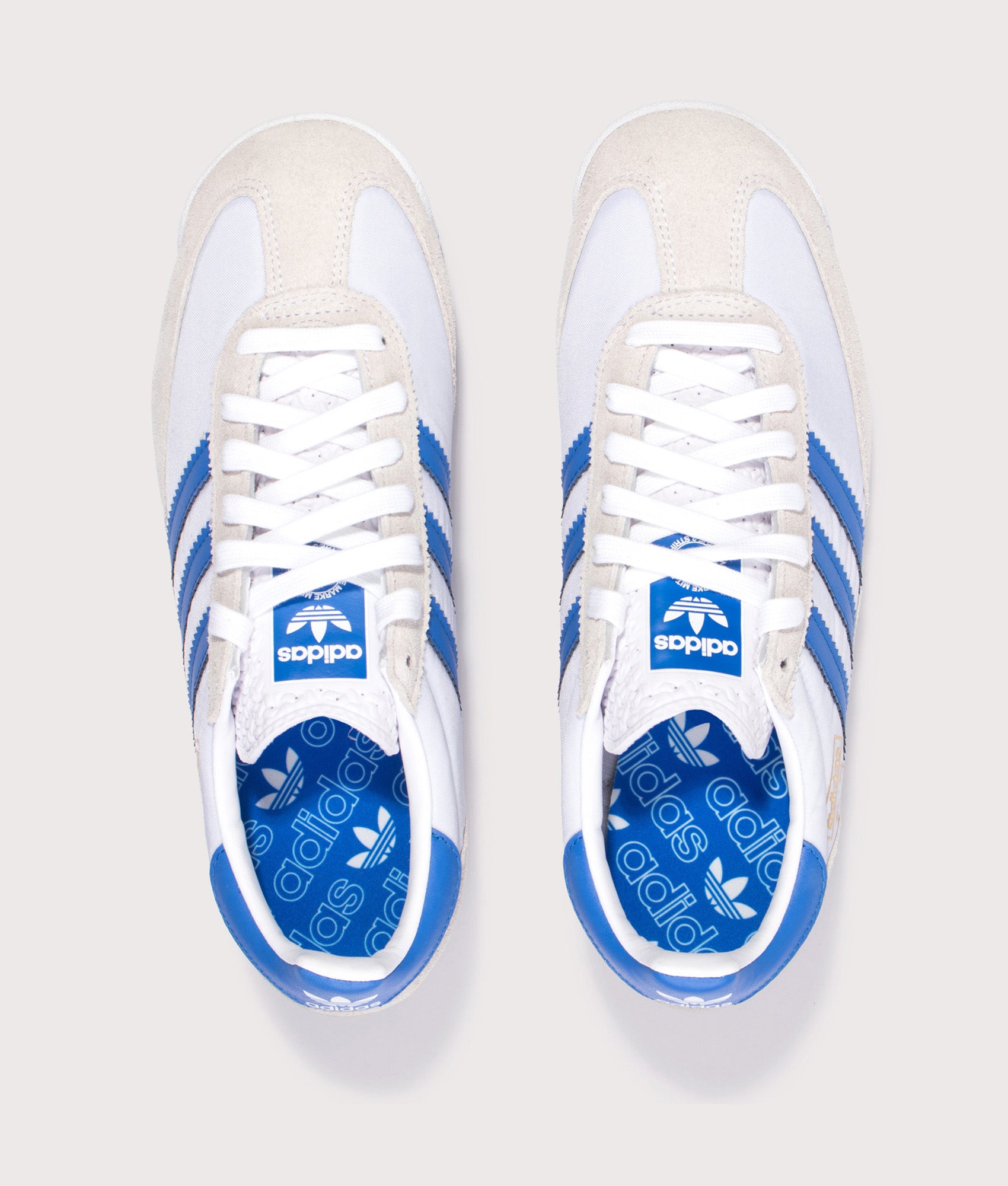 adidas Originals SL 72 RS Trainers in Footwear White, Blue and Core Black at EQVVS Menswear. Top shot. 