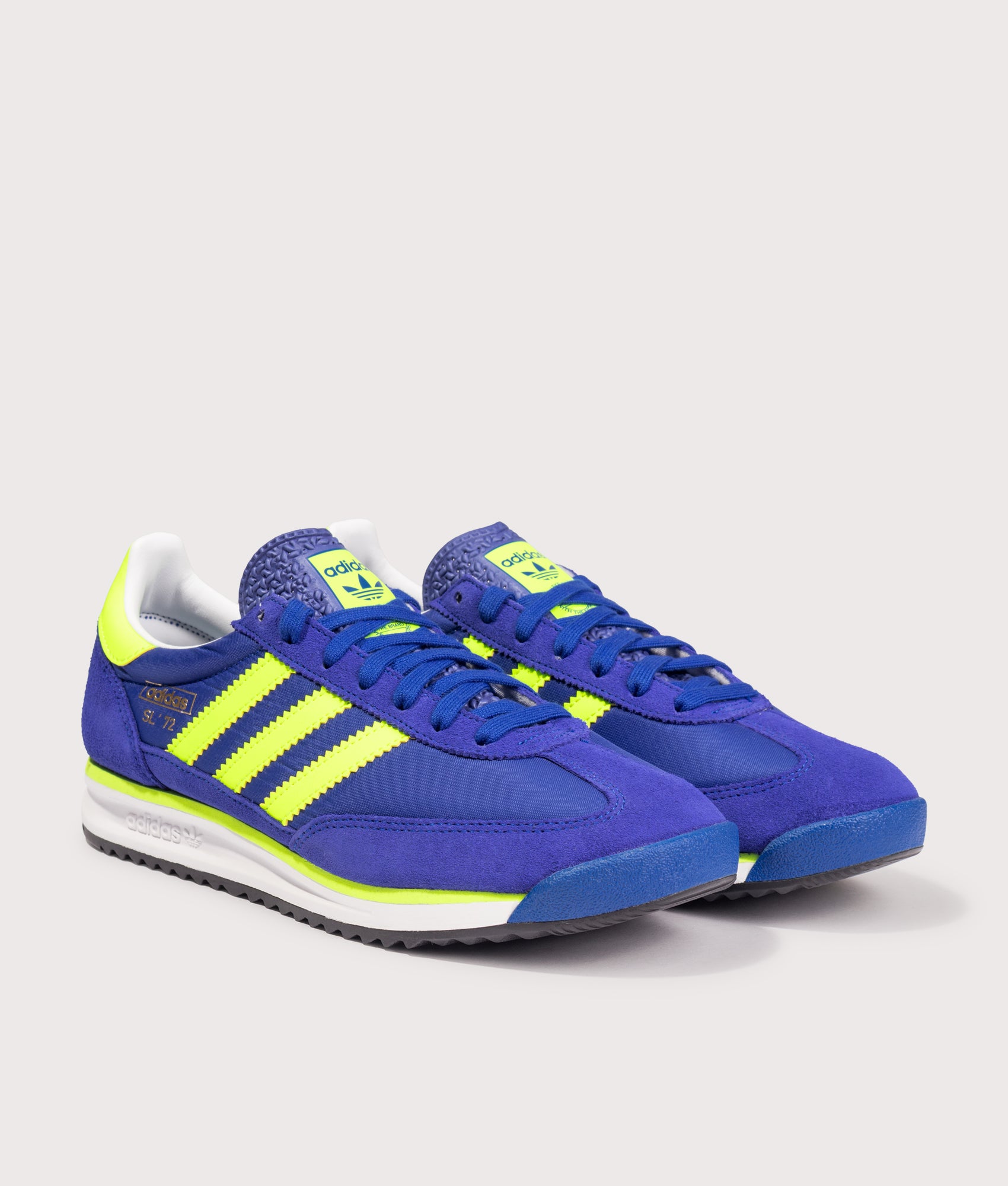 adidas Originals SL 72 RS Trainers in the Royal Blue, Solar Yellow and Footwear White at EQVVS Menswear. Angled front shot.