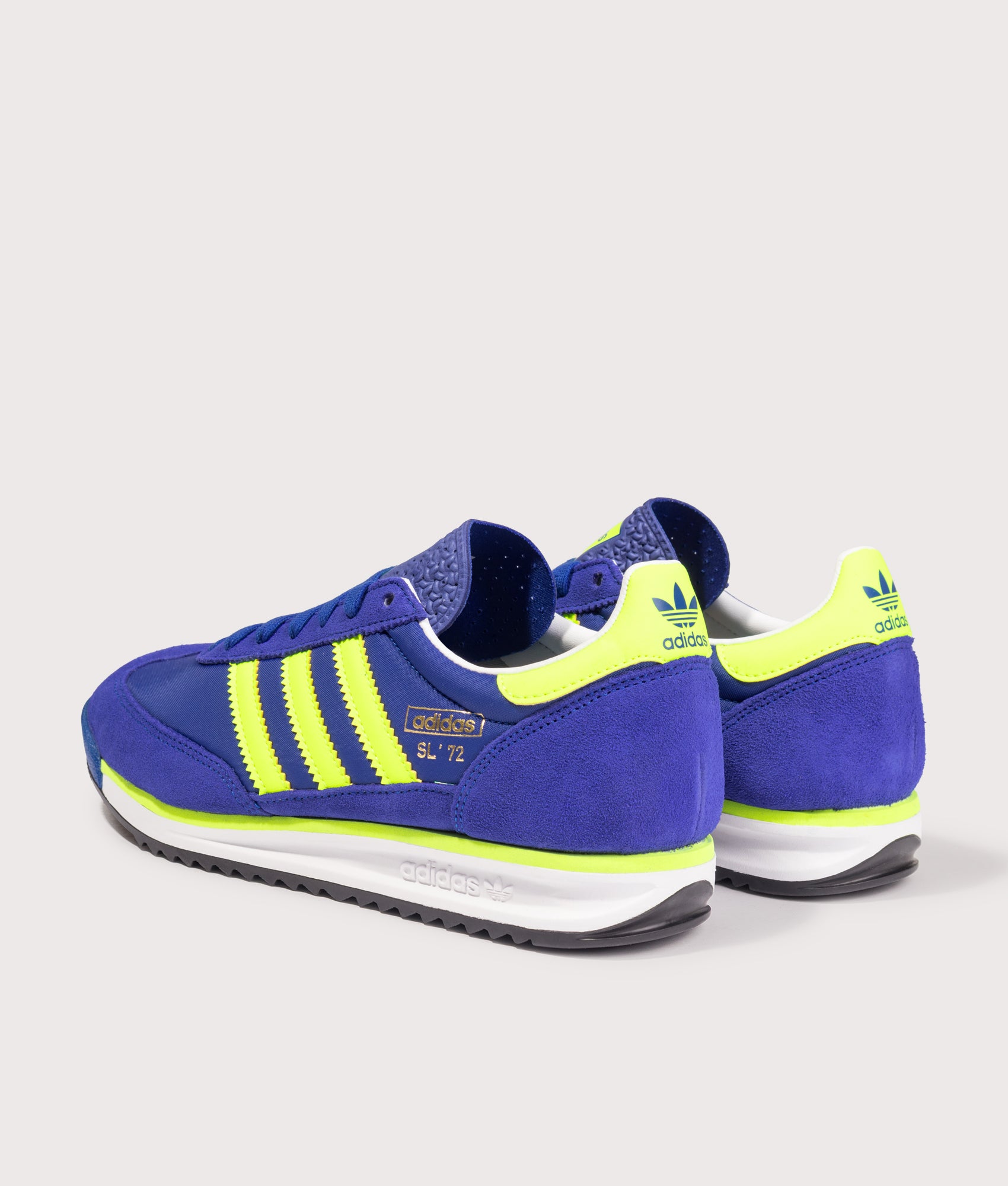 adidas Originals SL 72 RS Trainers in the Royal Blue, Solar Yellow and Footwear White at EQVVS Menswear. Angled back shot.
