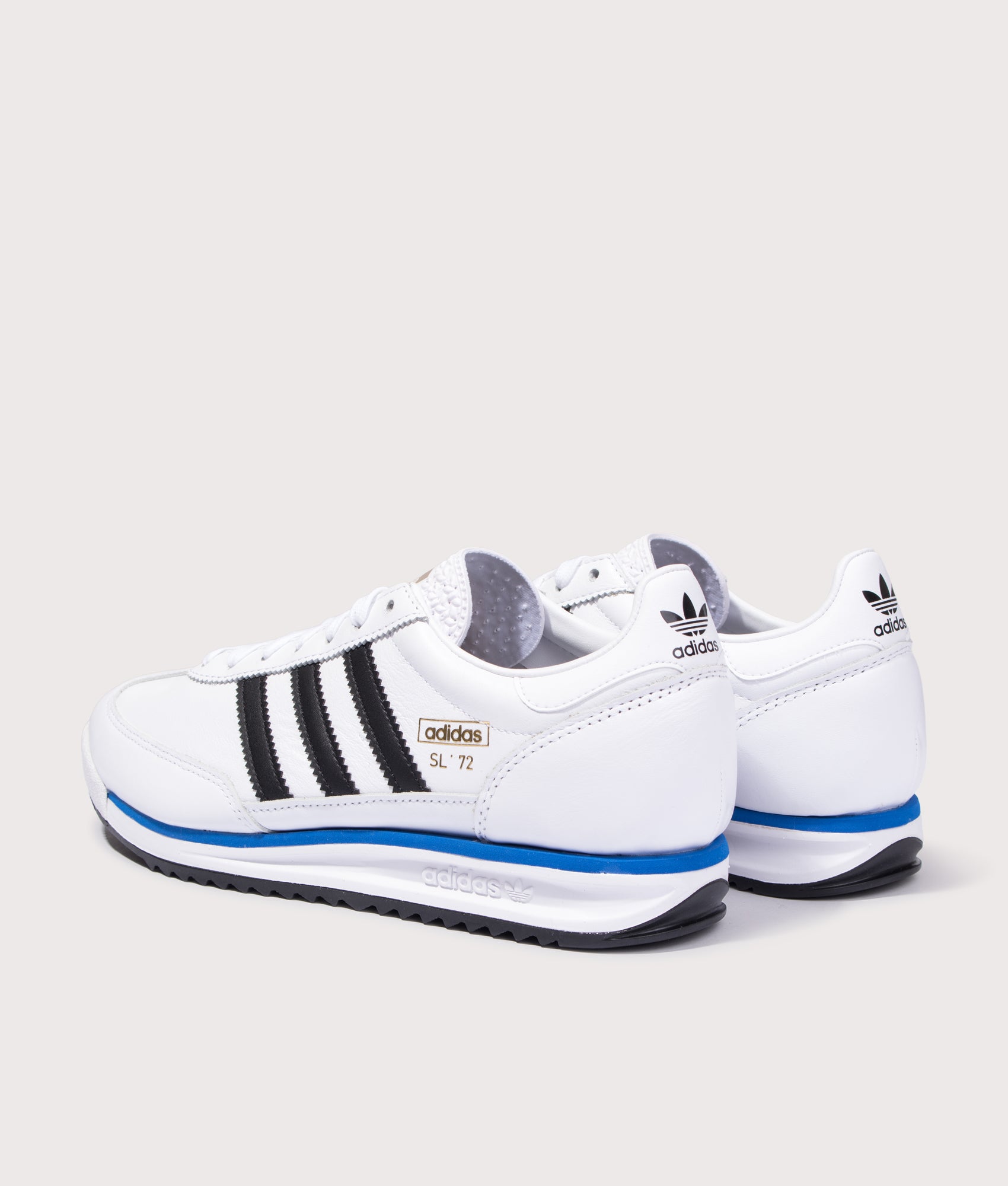 adidas Originals in Cloud White, Core Black and Blue Bird at EQVVS Menswear. Angled back shot.