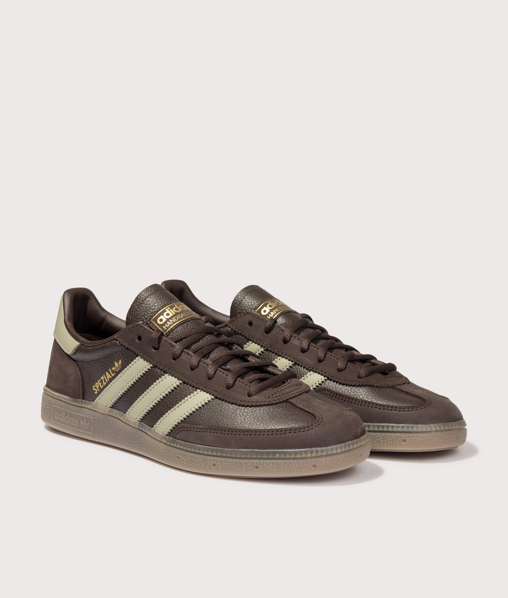 adidas Originals Handball Spezial Trainers in Aurora Coffee, Silver Pebble and Gum 5 at EQVVS Menswear. Angled front shot.