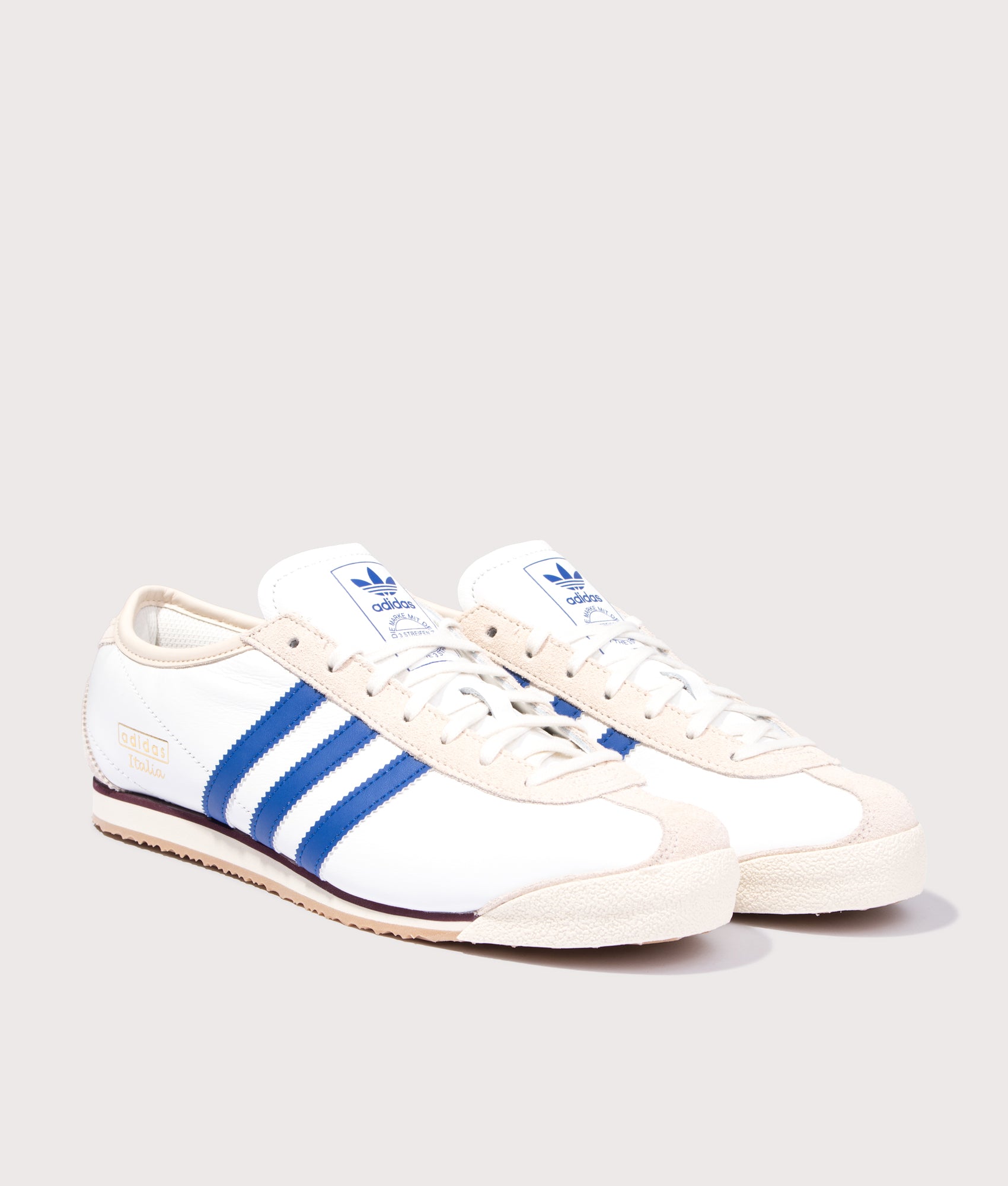 adidas Original Italia 70s Trainers in Cloud White, Royal Blue and Wonder White at EQVVS Menswear. Angled front shot.